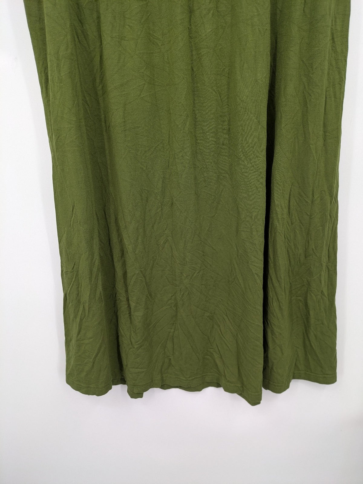 Bonprix green maternity dress with layered V-neck and empire waist design.