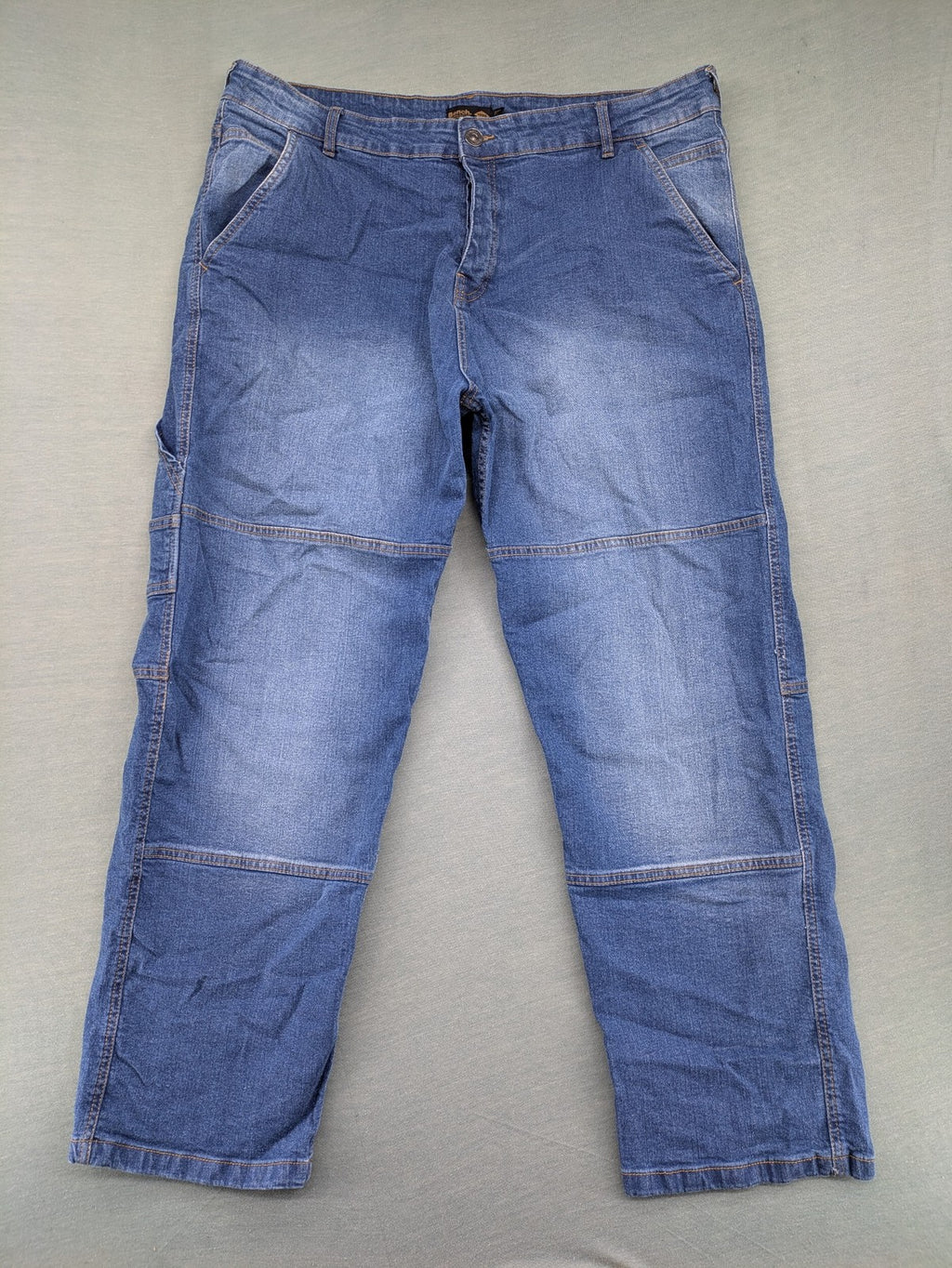 Bench blue straight jeans with reinforced knees and multiple cargo pockets.