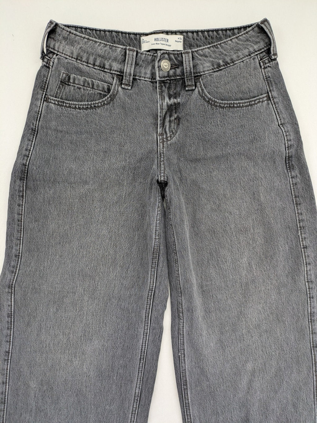 Hollister black tapered baggy jeans classic 5-pocket design with zipper and button closure.