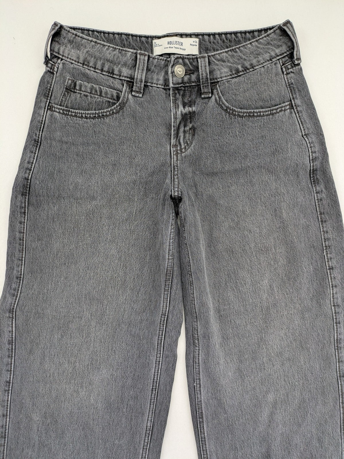 Hollister black tapered baggy jeans classic 5-pocket design with zipper and button closure.