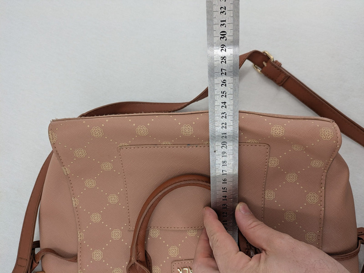 Catwalk gold handbag with pink and brown monogram pattern, adjustable shoulder strap.