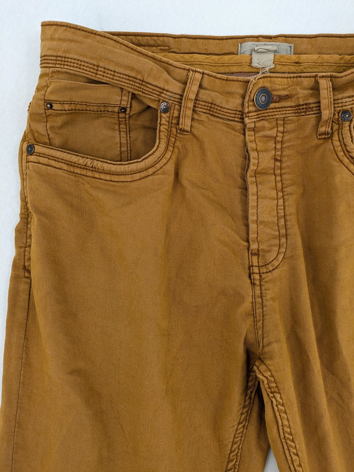 Bershka brown straight jeans slim fit classic 5-pocket design with prominent stitching.