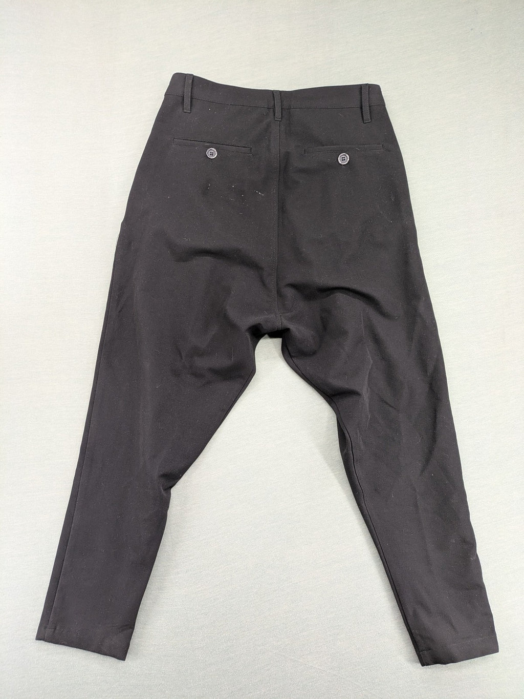 Jenny Joy pink harem pants with pleats, side pockets, and tapered legs.