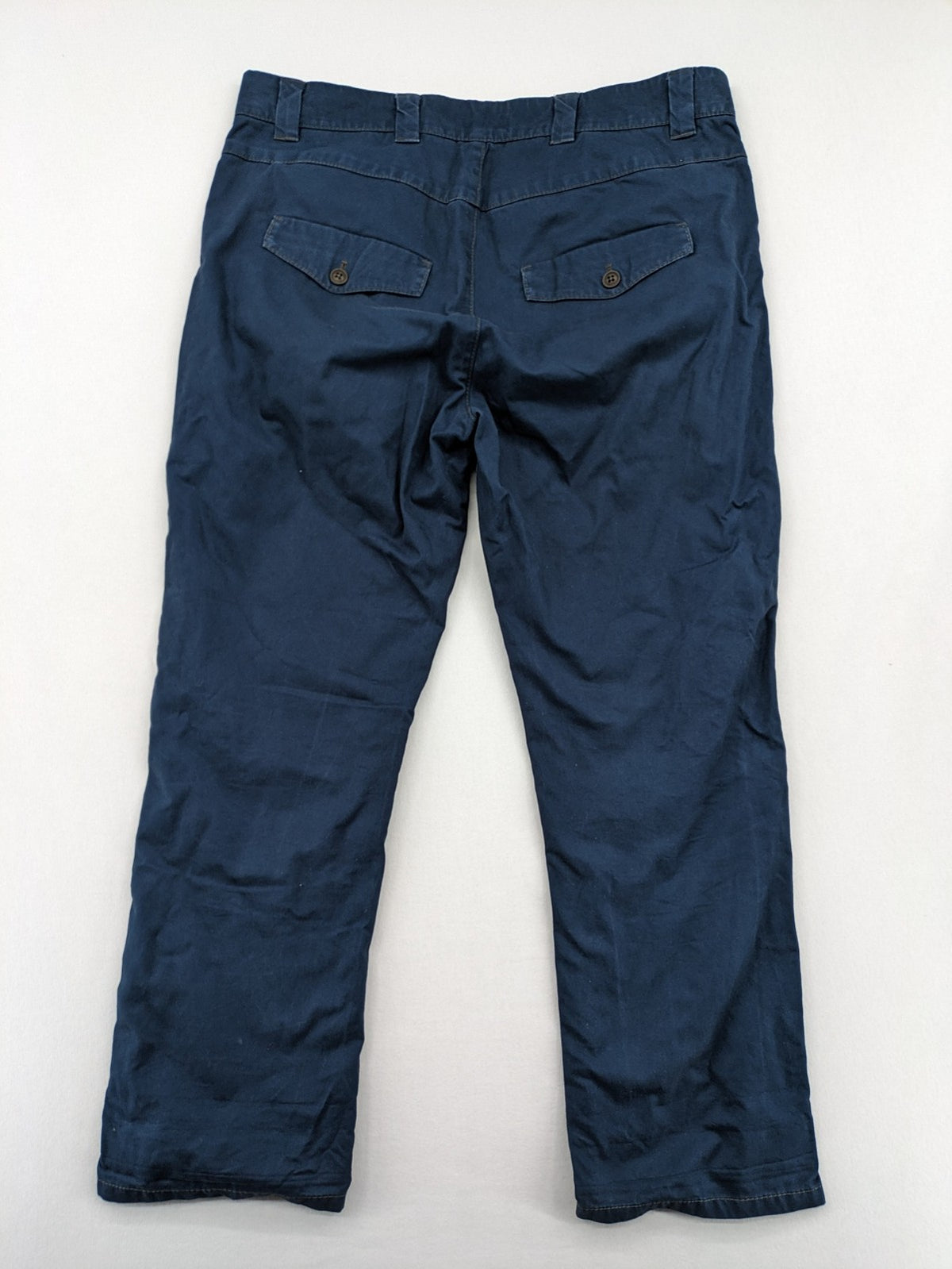 Marc O'Polo blue chino pants with button flap pockets and relaxed fit design.
