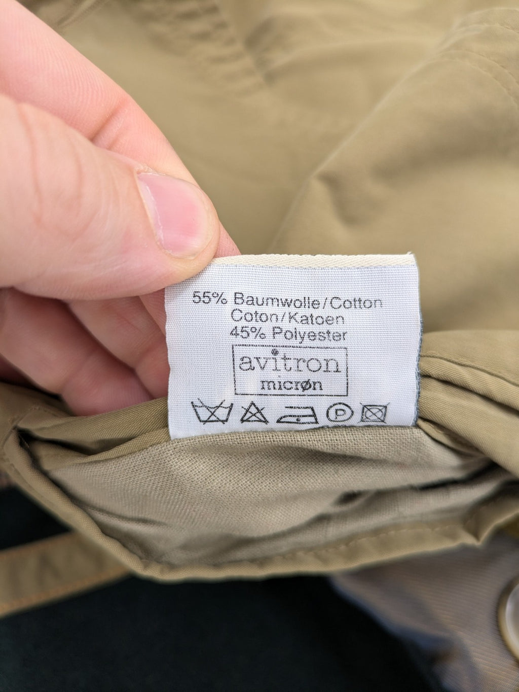 Studio Novum khaki trench coat double-breasted design with belt and wool lining.