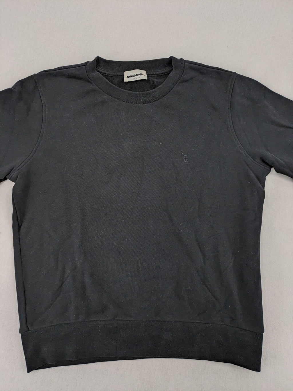 Armedangels black turtle neck jumper with embroidered logo, made from 100% organic cotton.