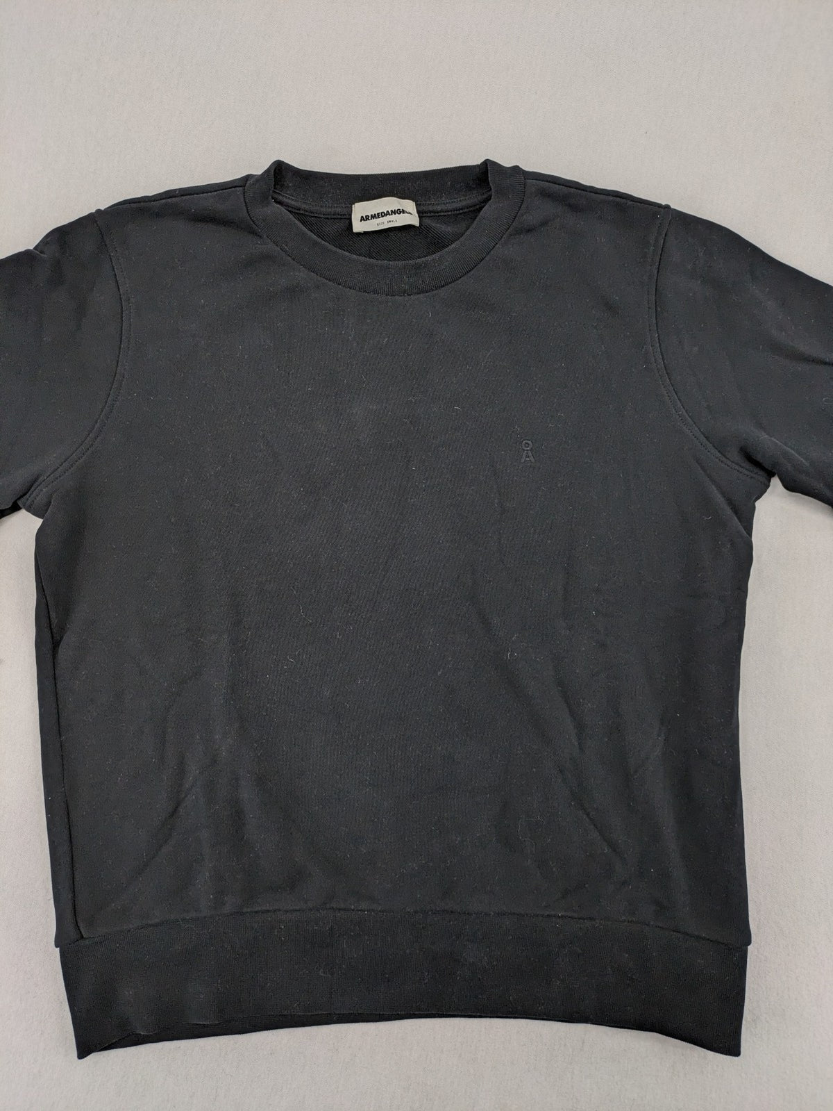 Armedangels black turtle neck jumper with embroidered logo, made from 100% organic cotton.