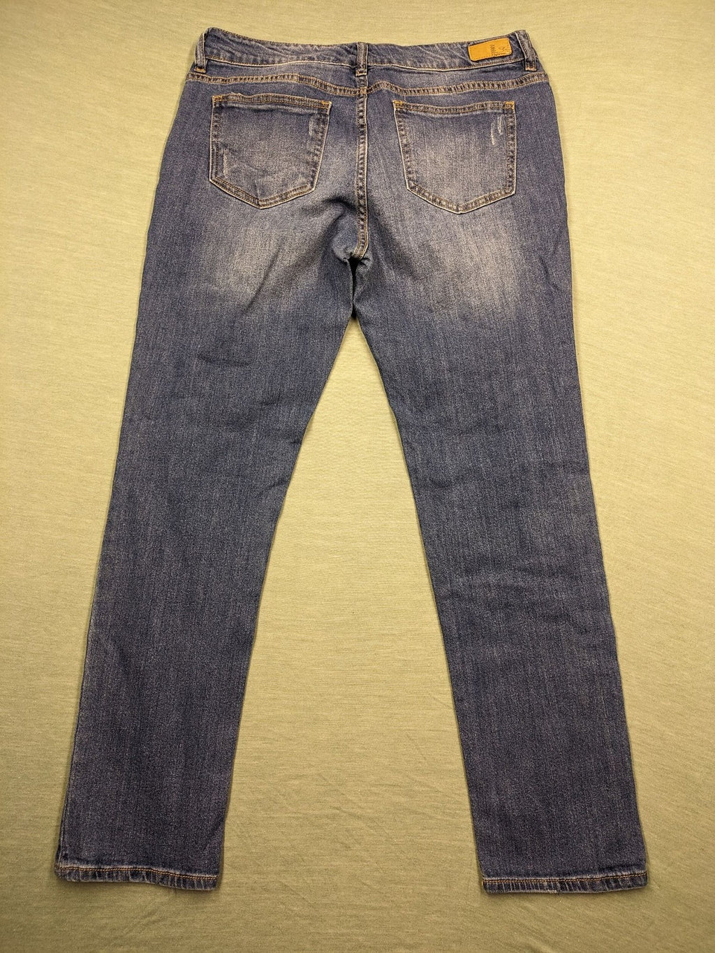 Peg blue ripped straight jeans with distressed details and comfortable stretch material.