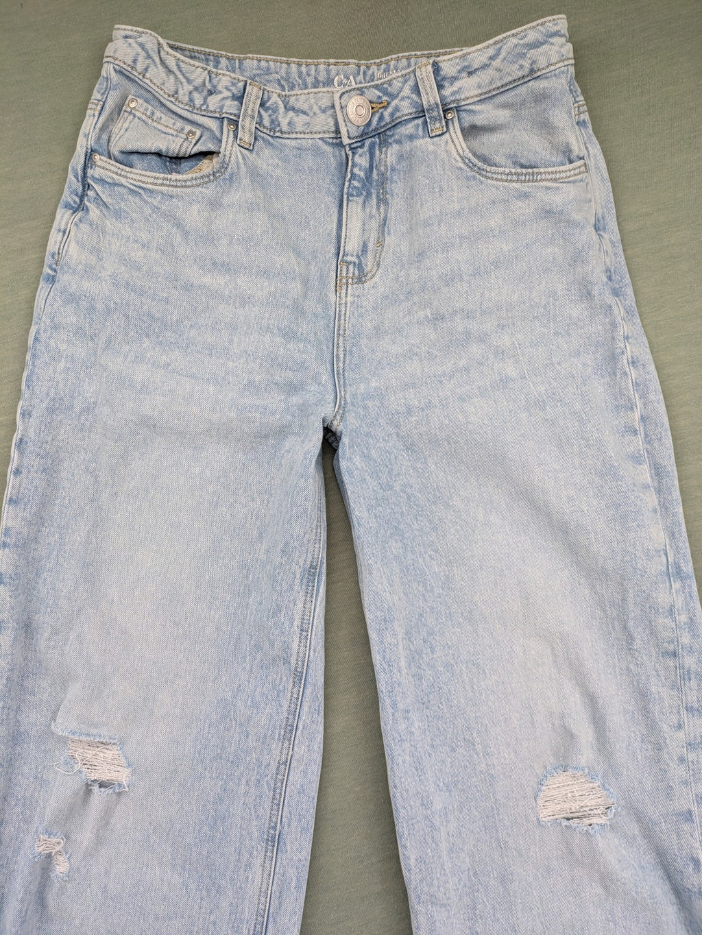 C&A blue wide leg jeans with distressed knee details and classic five-pocket design.
