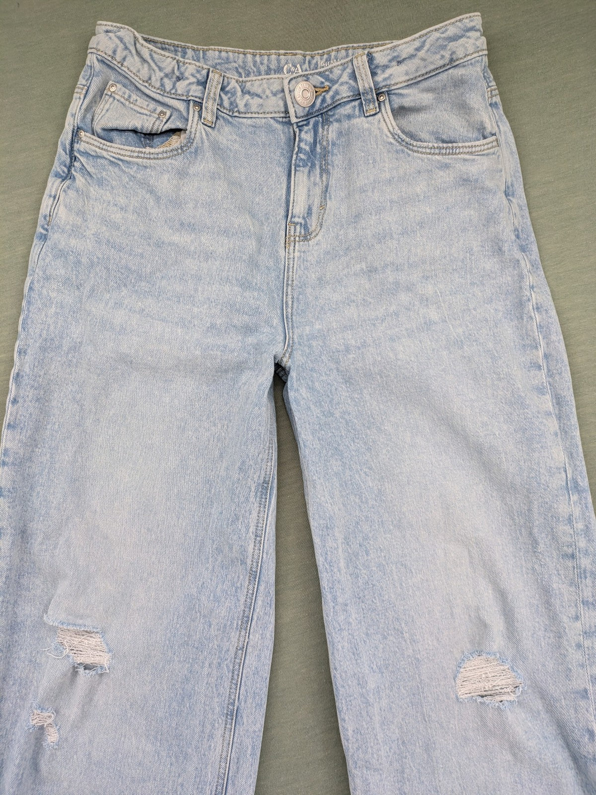 C&A blue wide leg jeans with distressed knee details and classic five-pocket design.