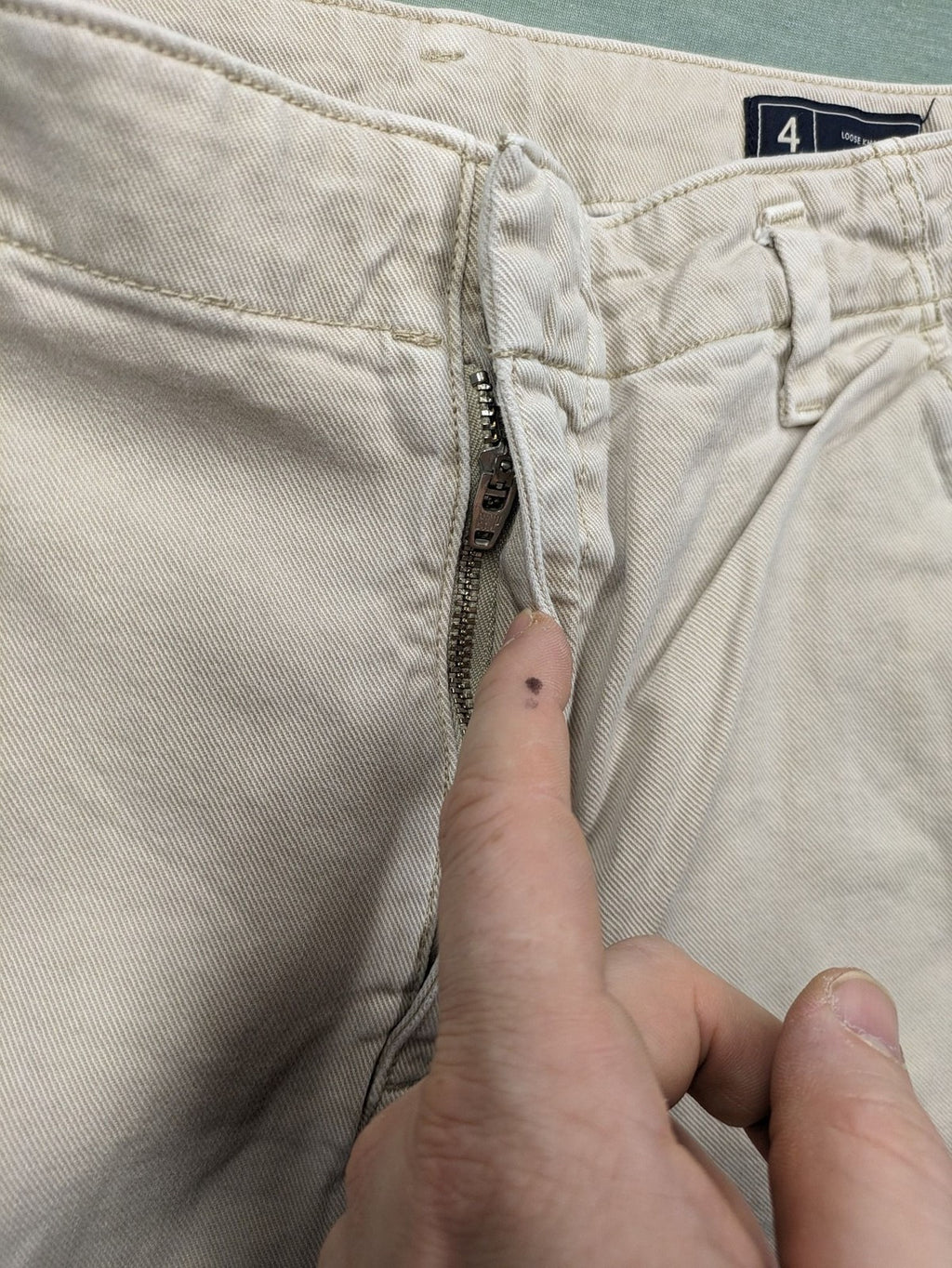 Gap beige loose-fit chino pants made from 100% cotton with relaxed wide-leg design.