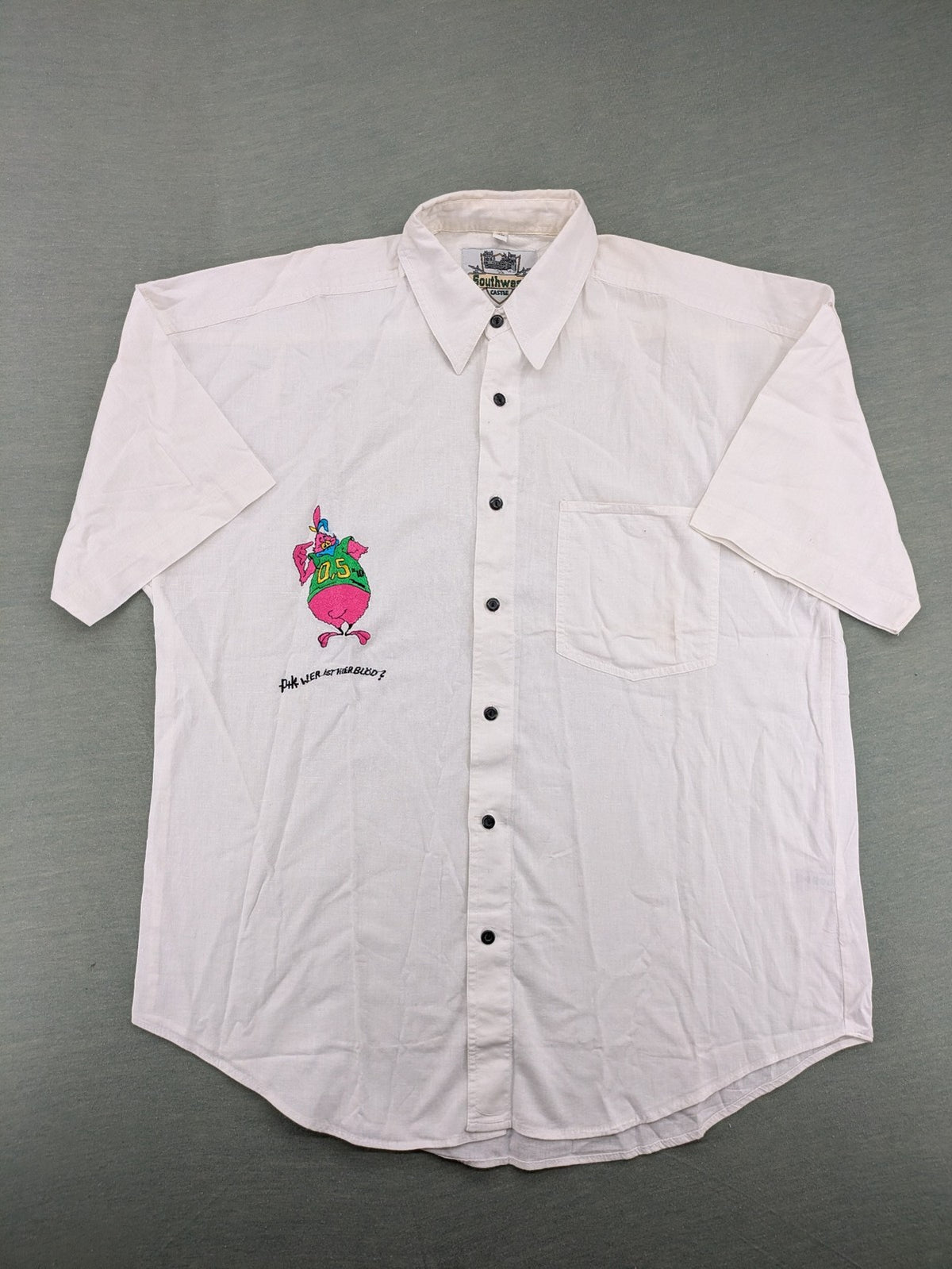 Southwest Castle vintage short-sleeve shirt white with colorful cartoon embroidery and German text.