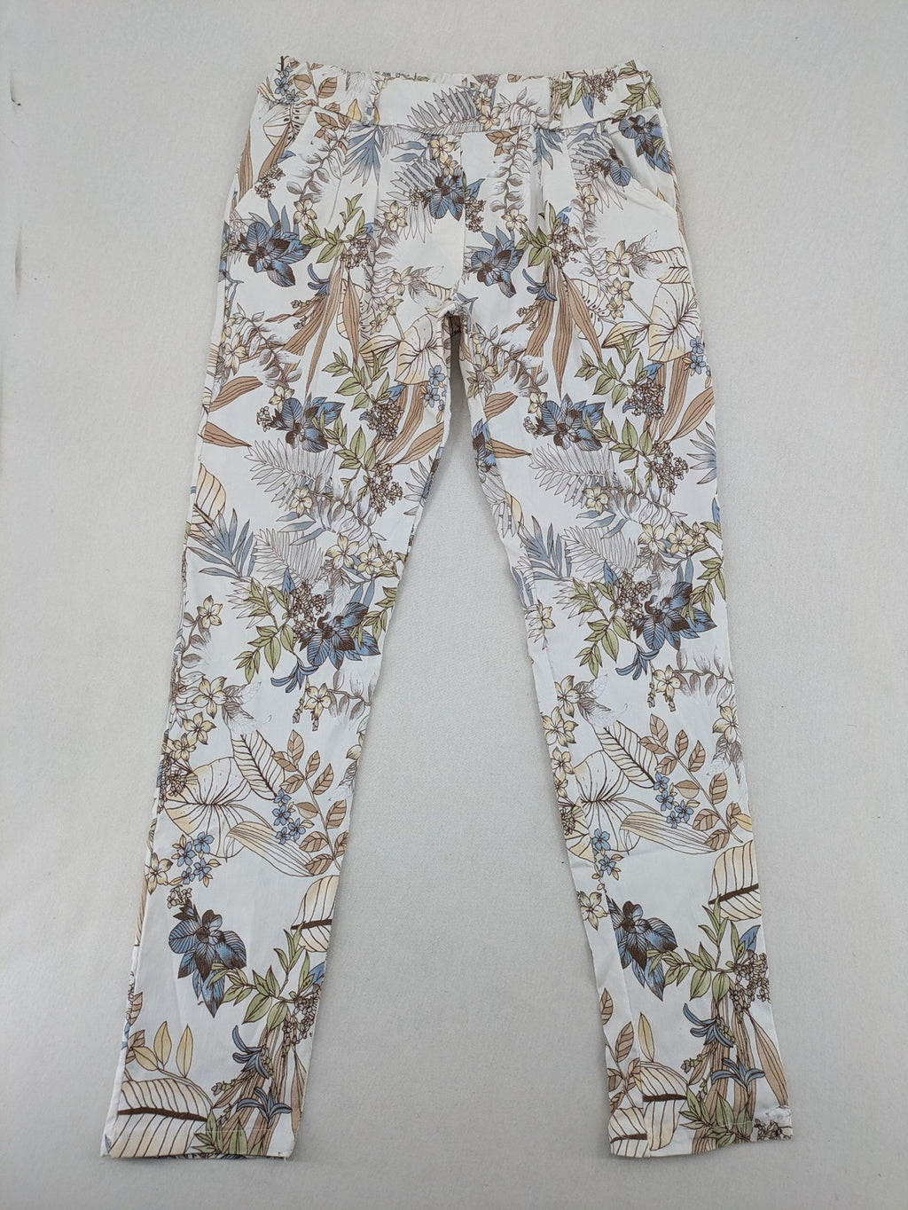 Made in Italy multi pants tropical floral pattern cotton-viscose blend on white background.
