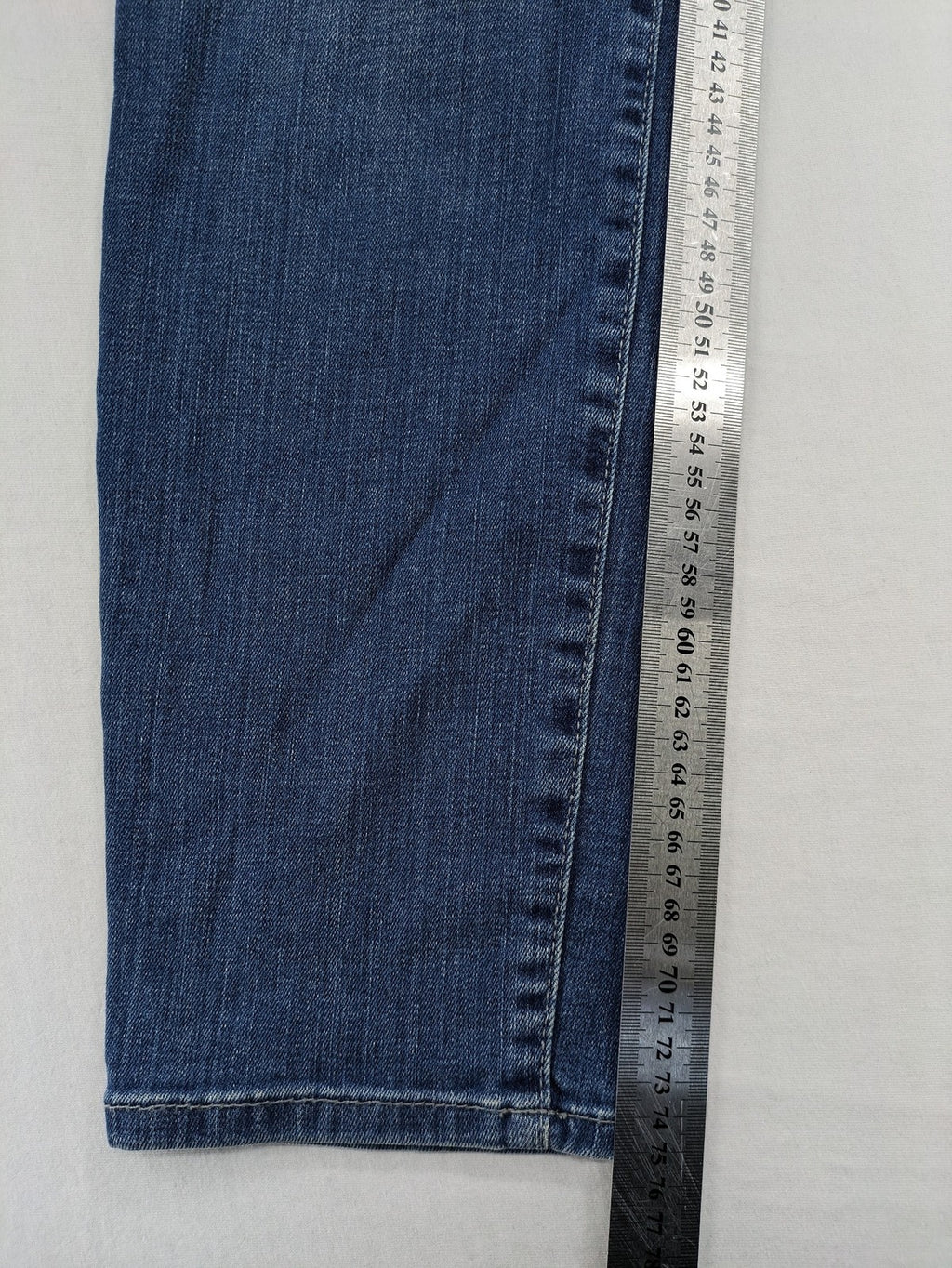 Gerry Weber blue straight jeans with decorative rhinestone appliqués and stretch denim material.