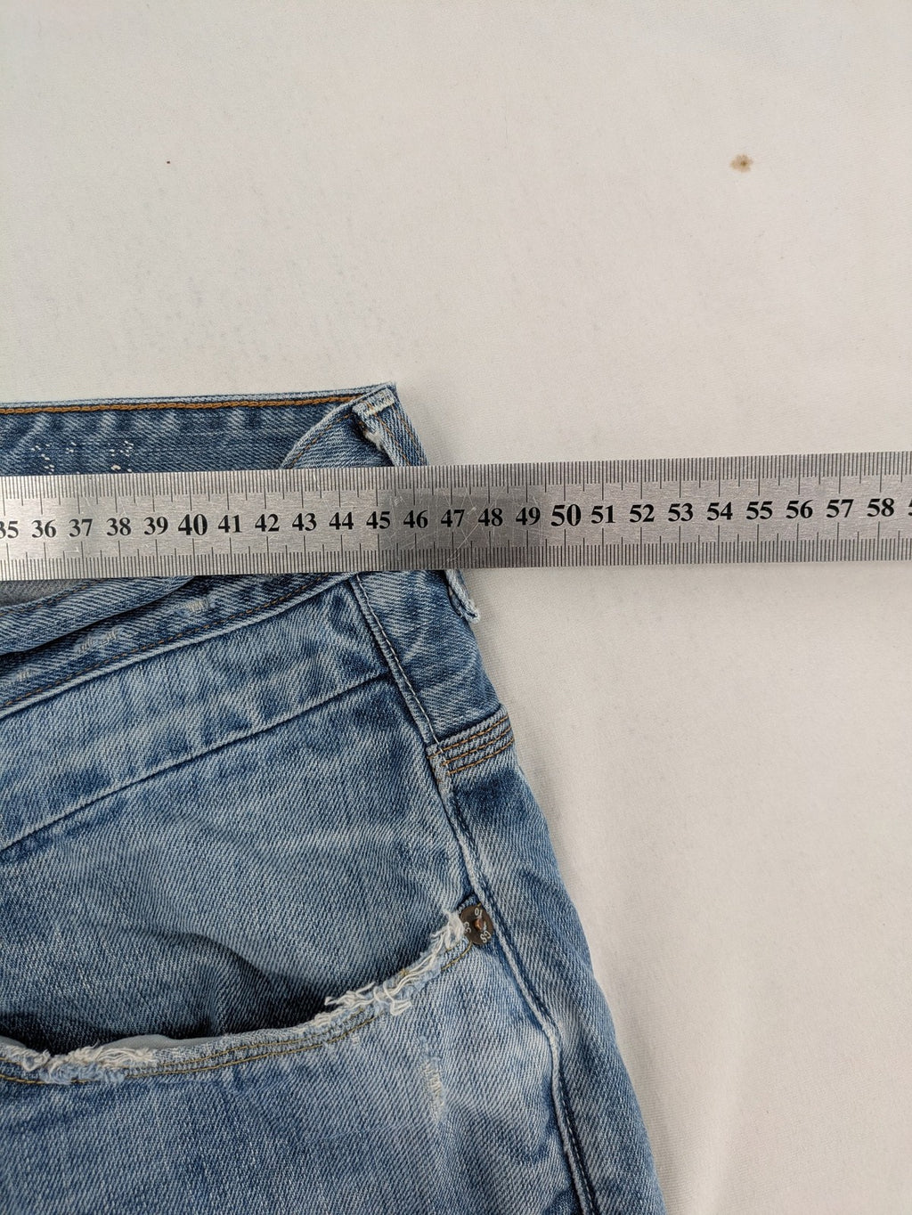 G-Star Raw blue straight jeans with distressed details and classic button fly.