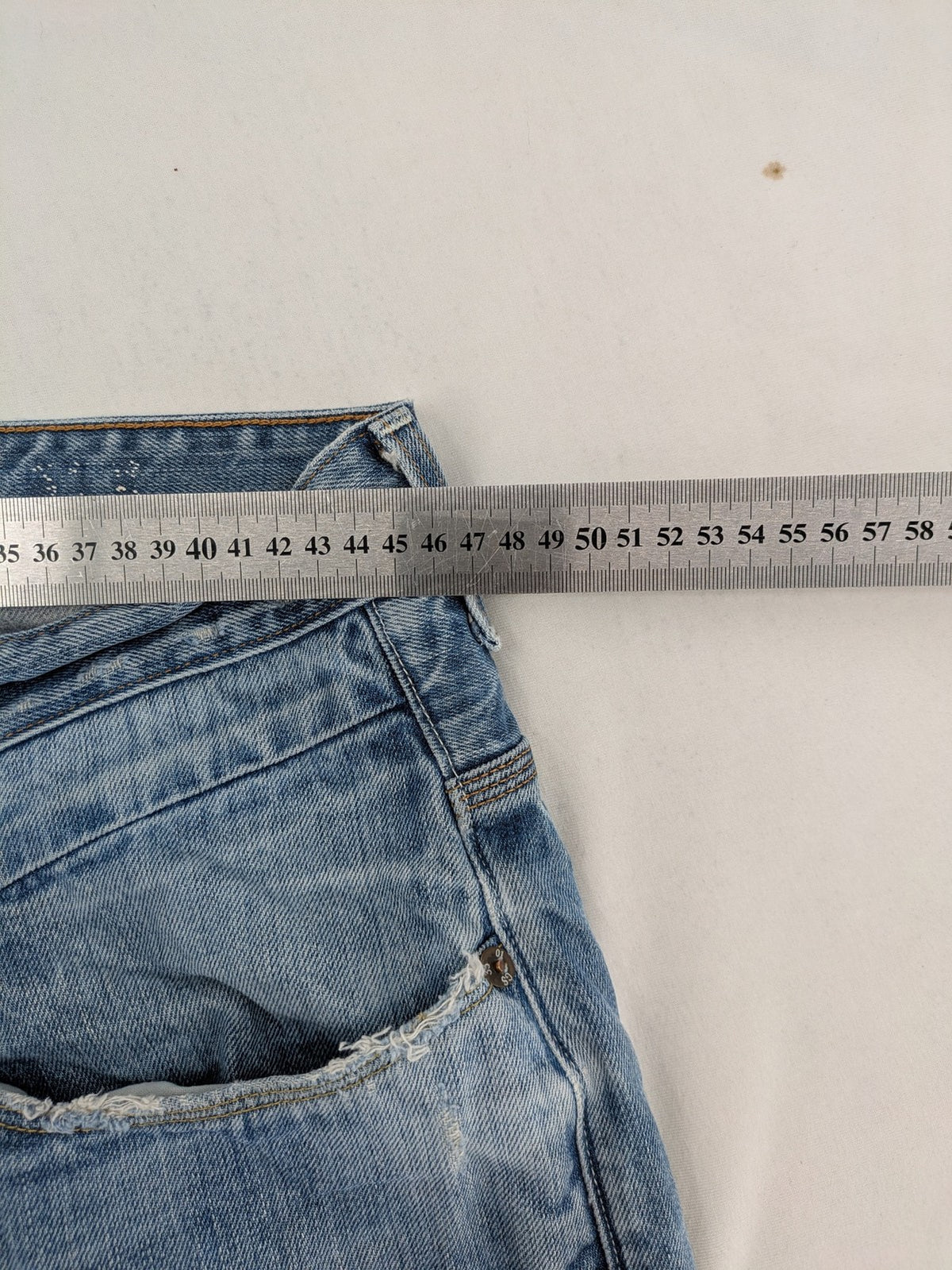 G-Star Raw blue straight jeans with distressed details and classic button fly.