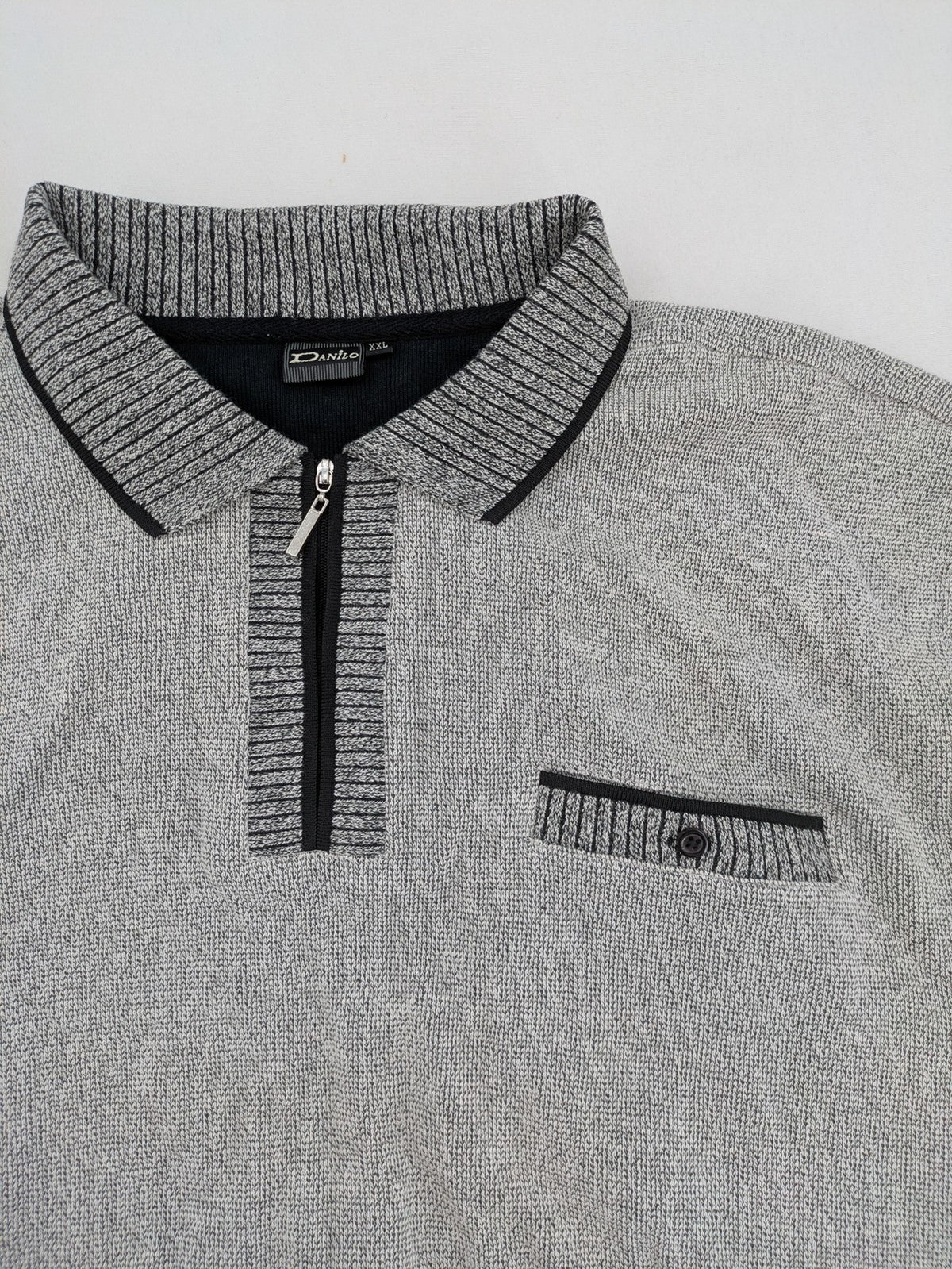 Danilo turtle neck jumper grey melange with black zipper and ribbed cuffs.