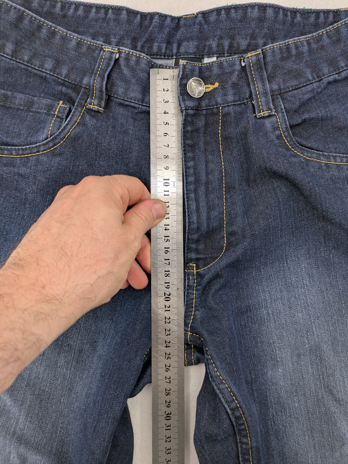 C&A blue straight leg jeans with classic 5-pocket design and faded wash details.