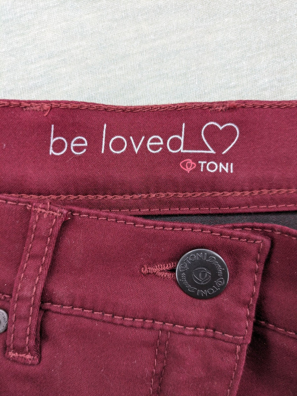 TONI burgundy straight jeans CS-Slim-Fit with subtle rhinestone detail on pocket.