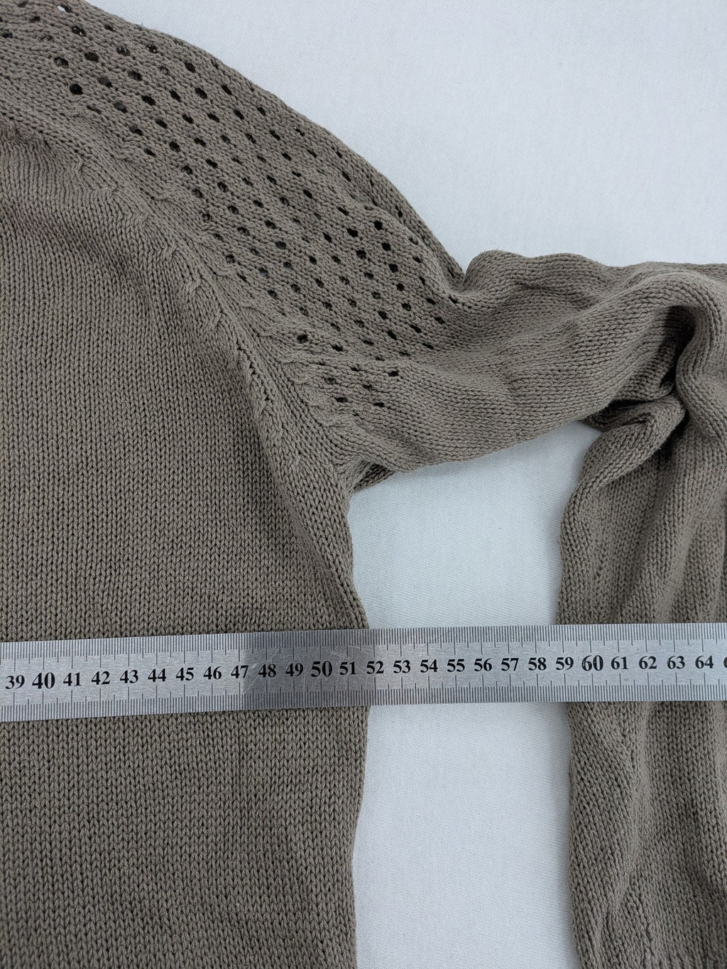 Dressin brown knit jumper with decorative open-knit details and comfortable fit.