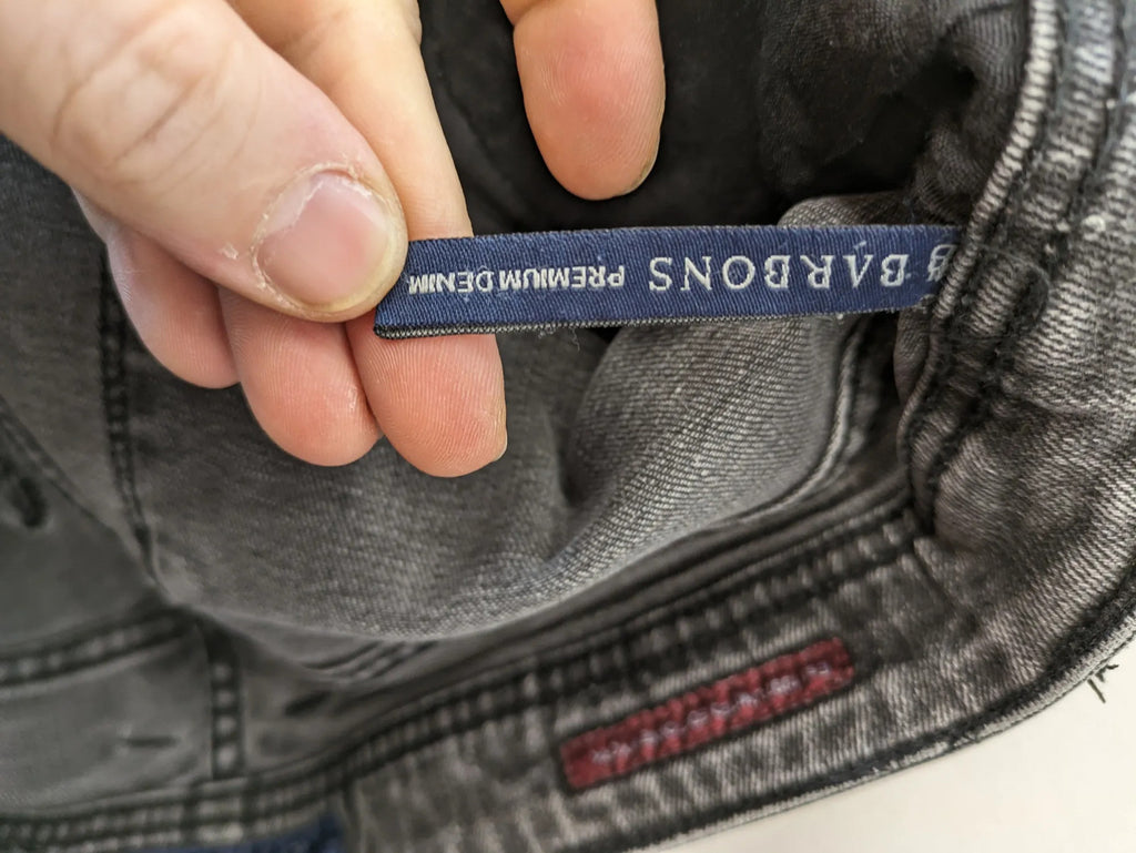 Denim grey straight jeans 5-pocket design with subtle brand details and zipper closure.