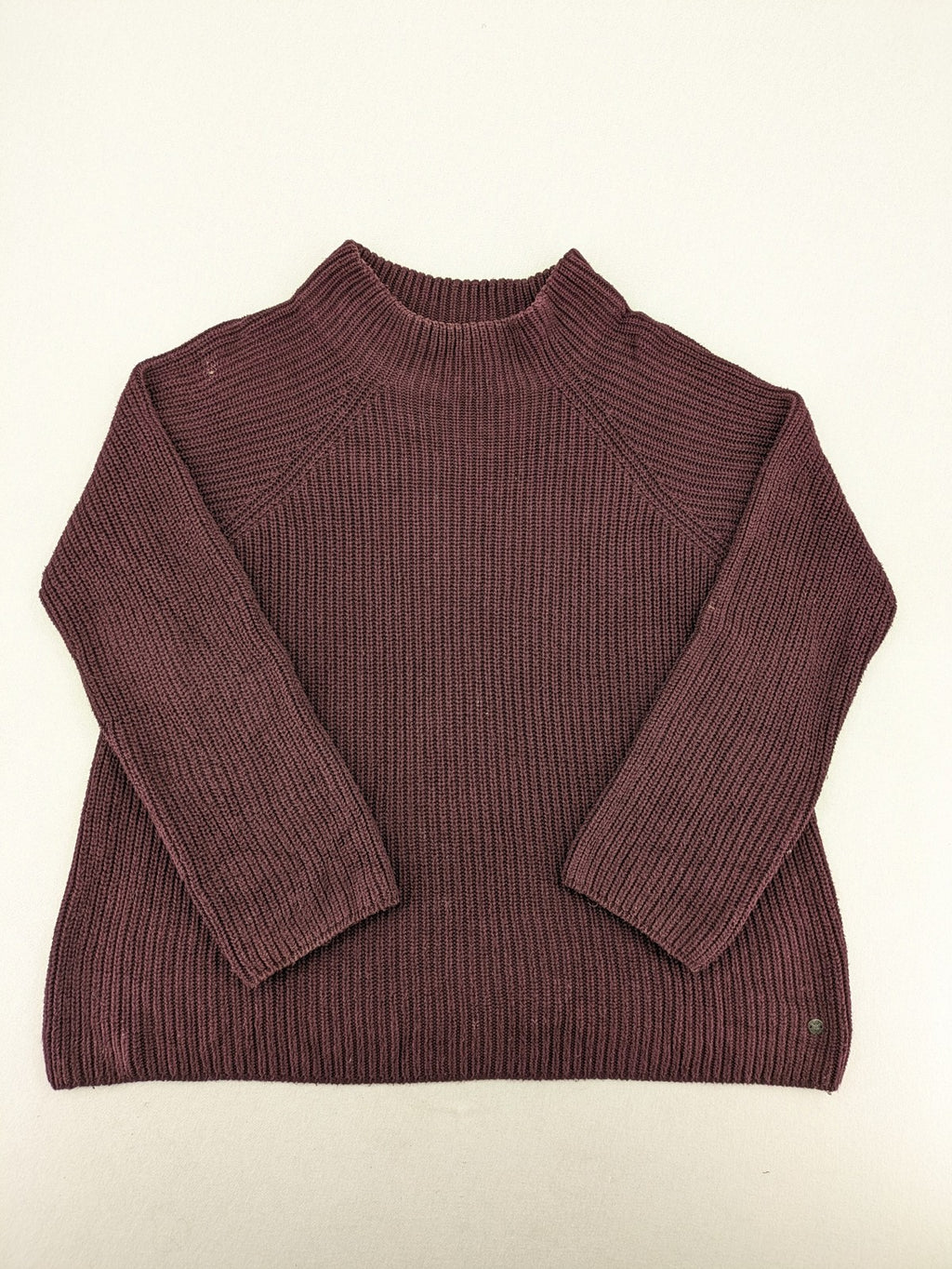 Monari burgundy knit jumper with standing collar, ribbed texture, and raglan sleeves.