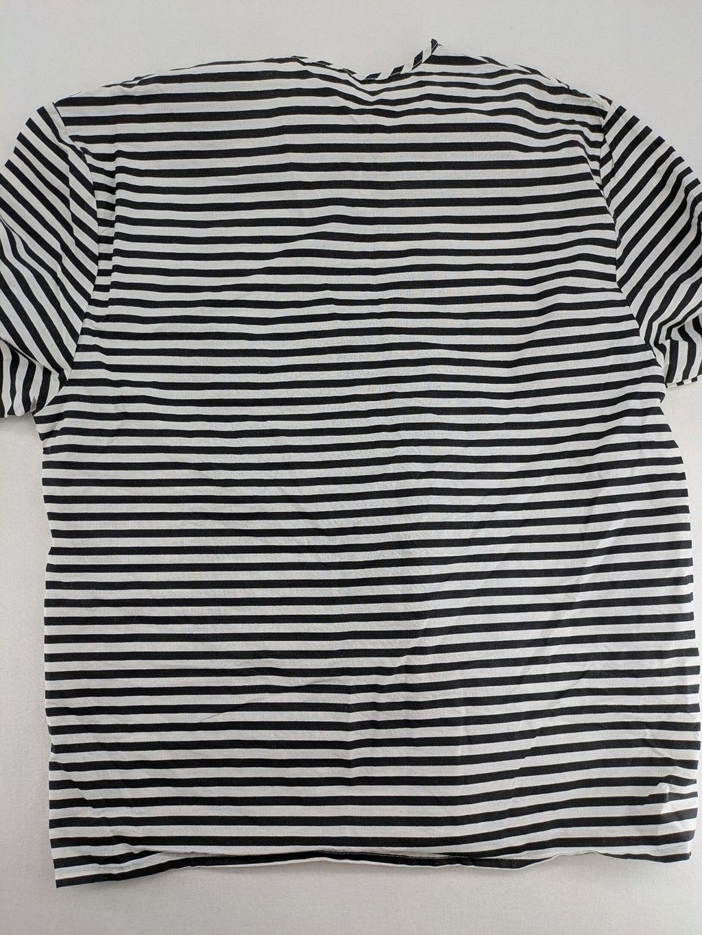 Rubie's costume set black and white striped with prisoner number patch on chest.