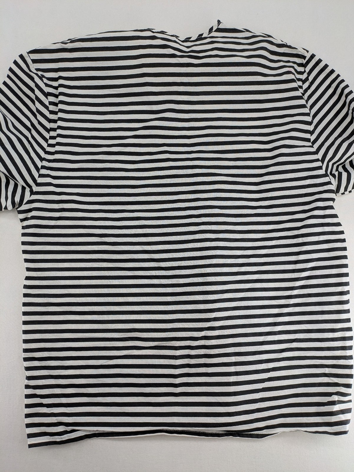 Rubie's costume set black and white striped with prisoner number patch on chest.