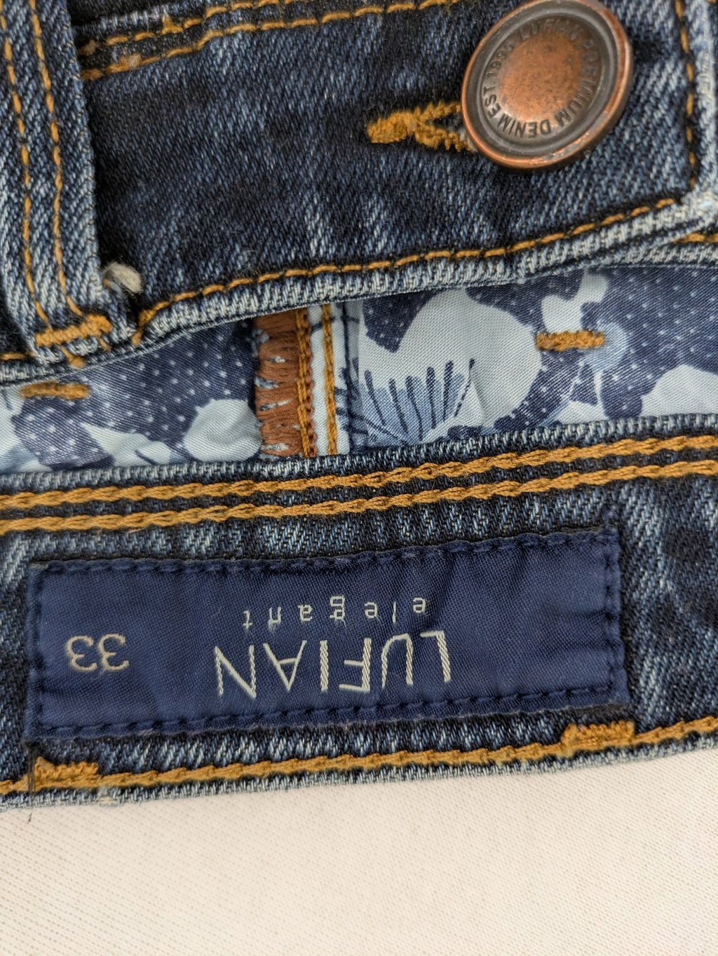 Lufian blue straight jeans dark wash distressed 5-pocket style with stretch denim.