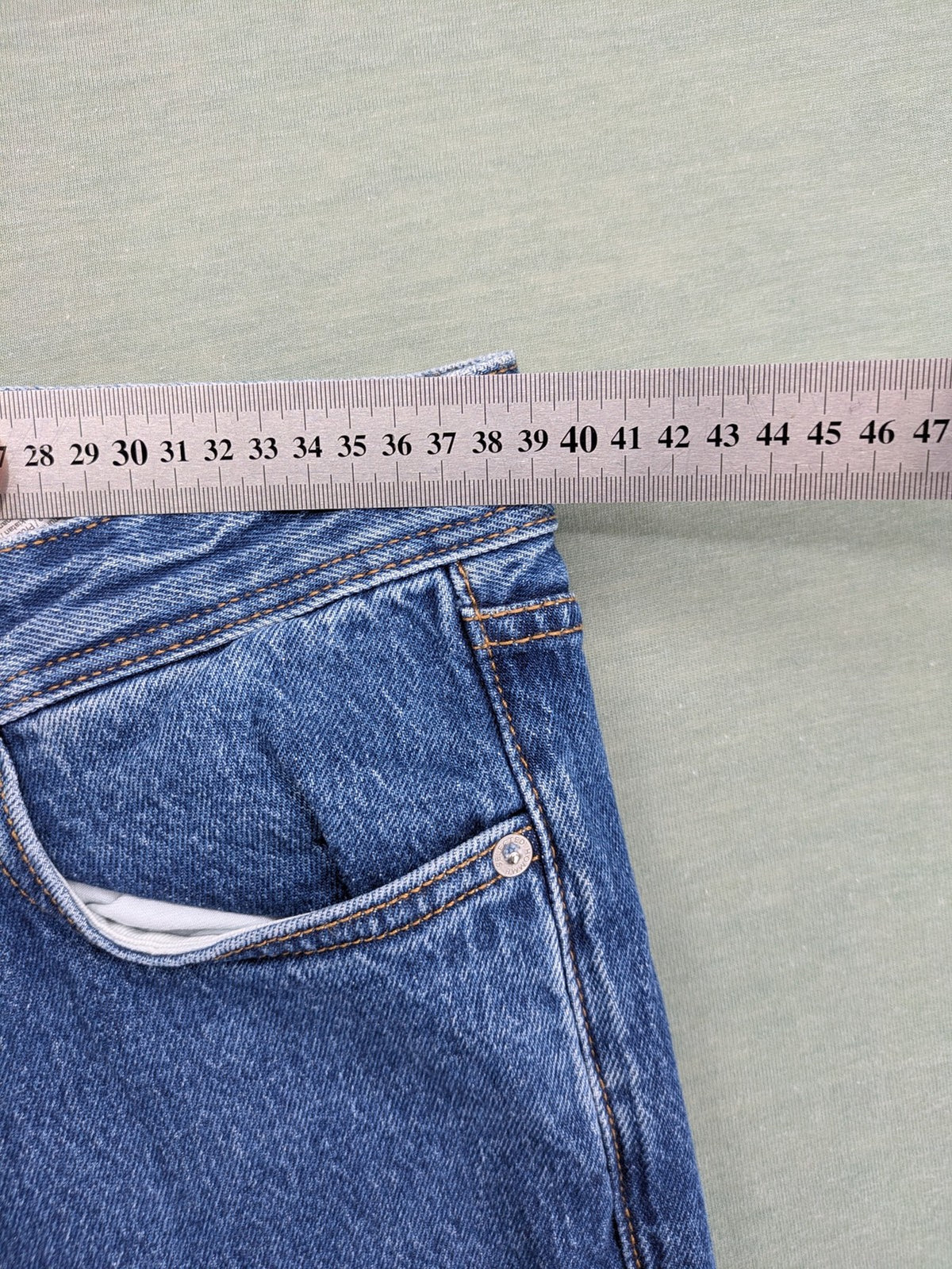Selected Homme blue straight fit jeans with classic five-pocket design and medium wash denim.