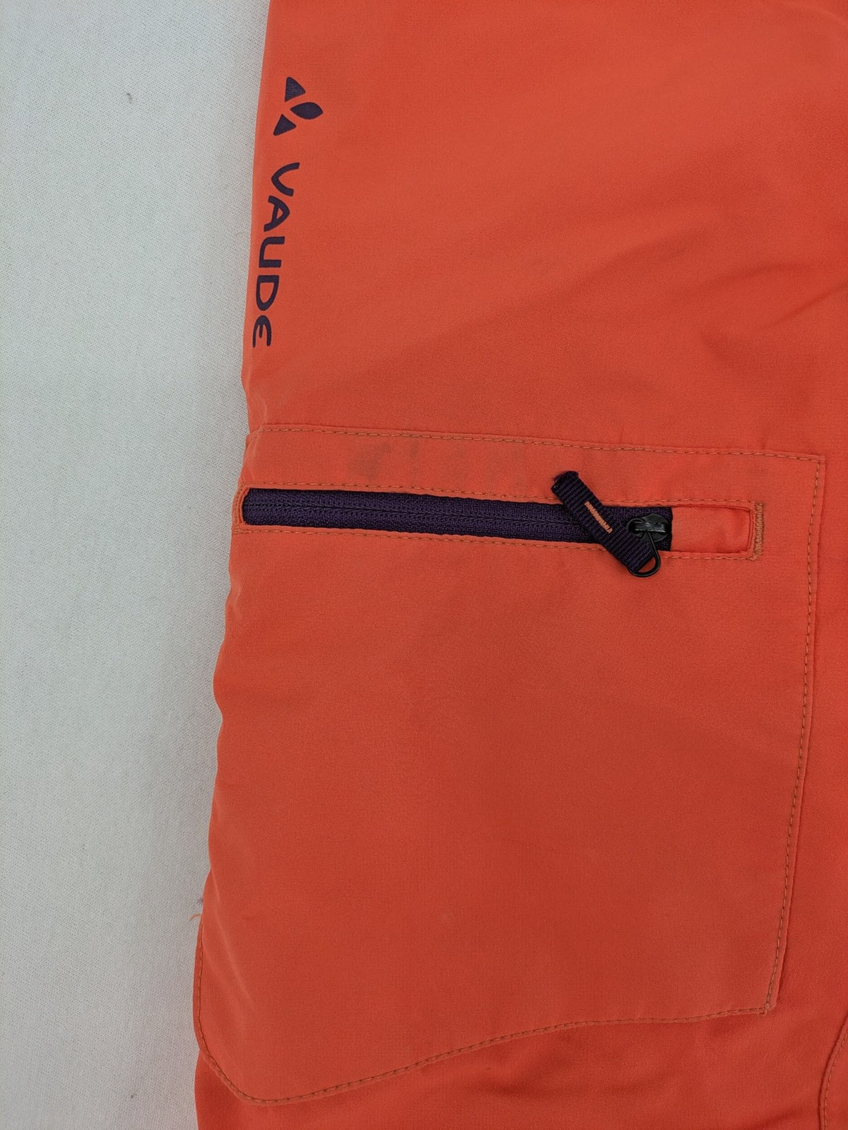 Vaude orange ski pants with logo, Primaloft insulation, and Ceplex Active membrane.