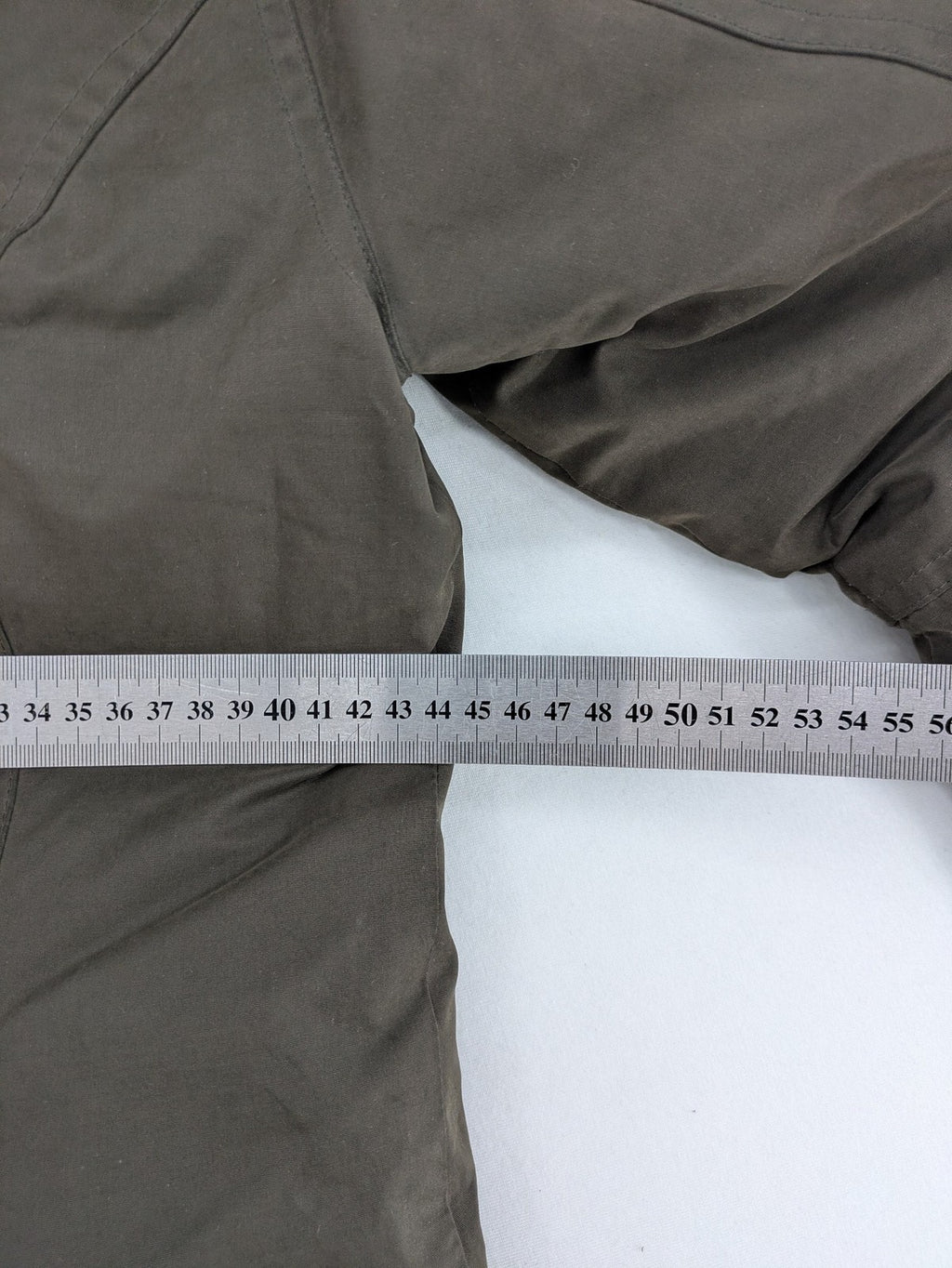 ONLY khaki parka coat with hood, quilted lining, and ribbed cuffs.