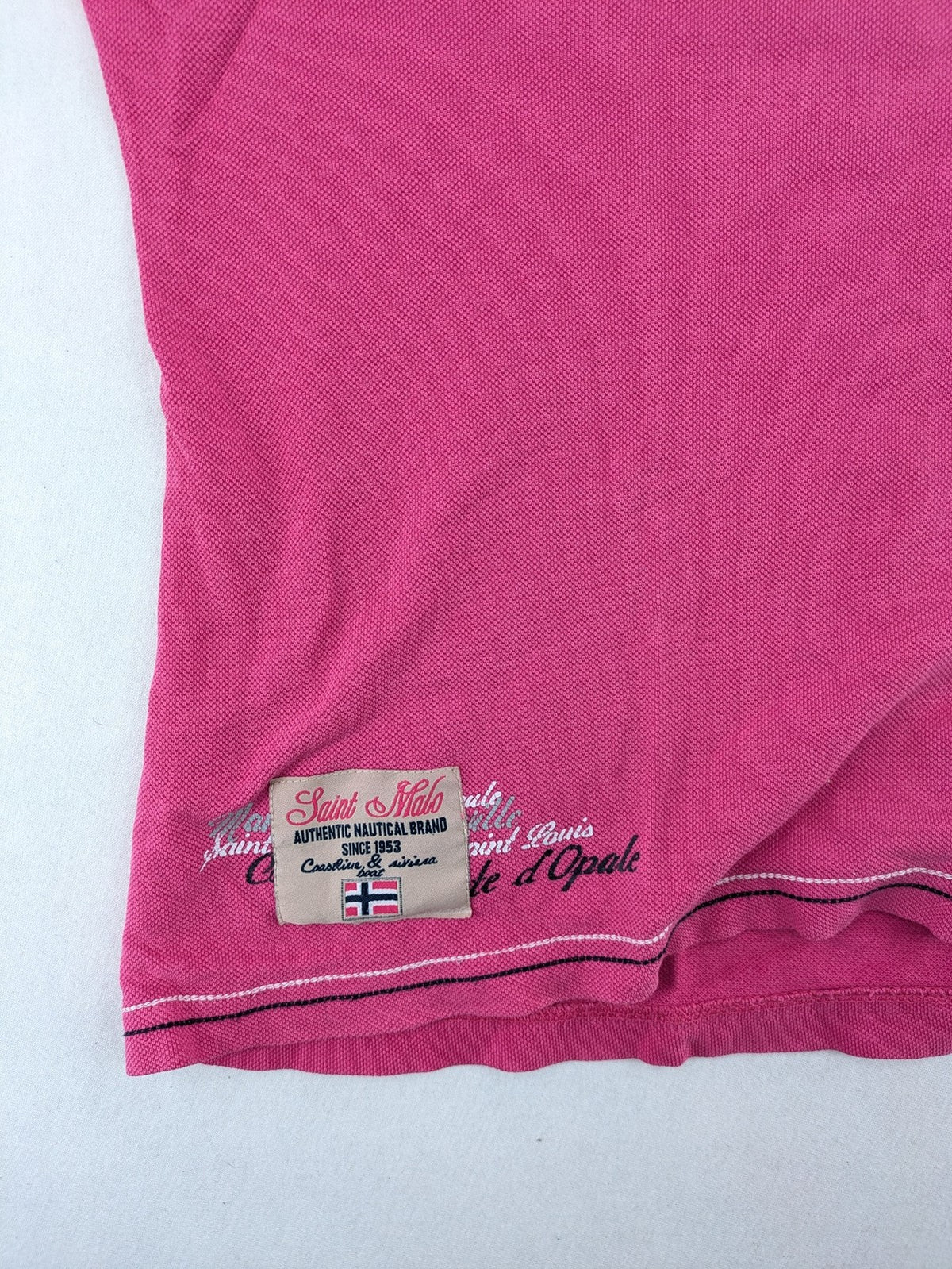 Geographical Norway pink polo shirt with embroidered Saint Malo design and Gingham trim.