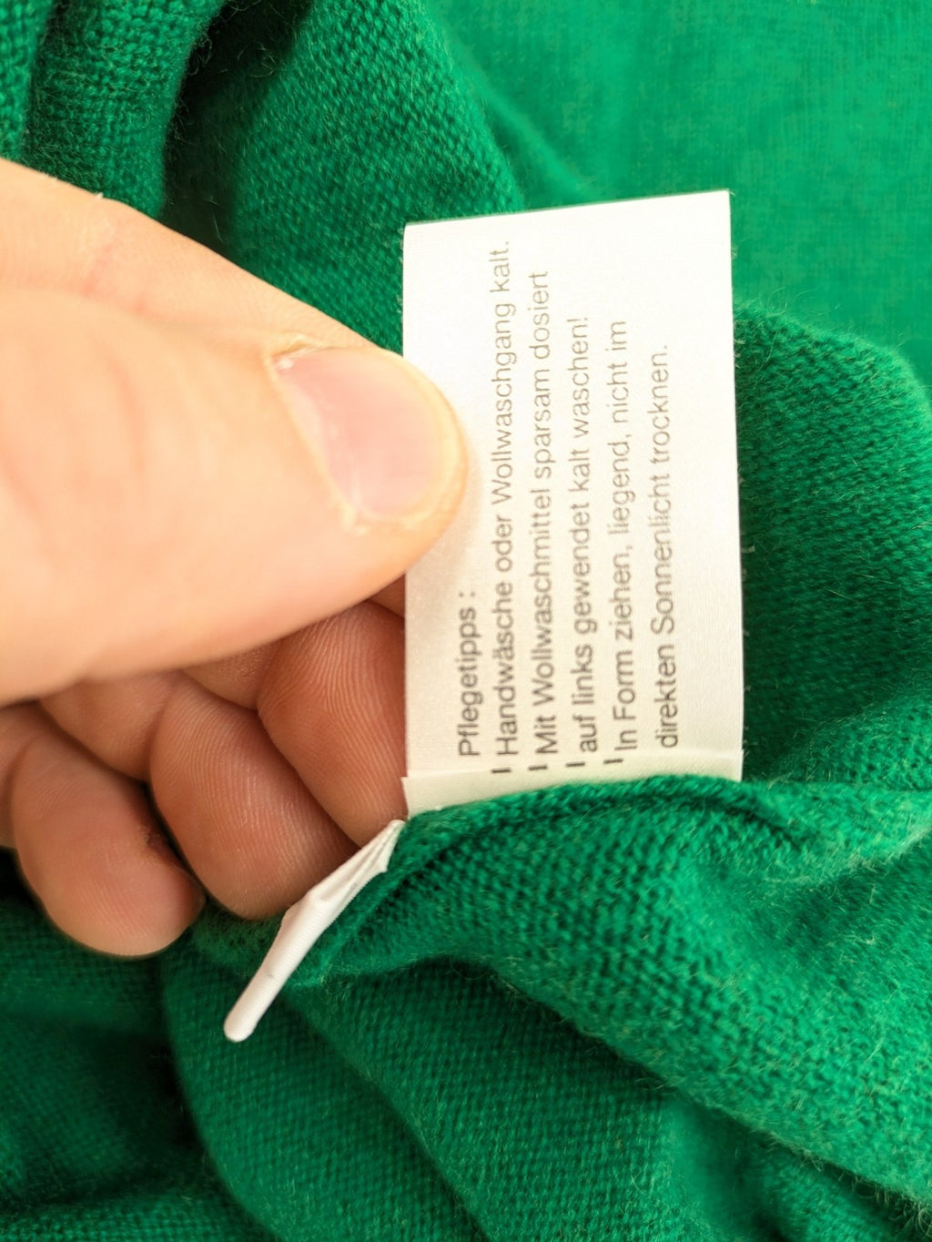 Pullover green cashmere turtle neck jumper with classic V-neck and long sleeves.