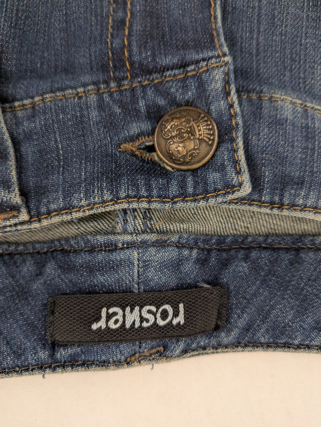 Rosner blue wide leg jeans with colorful embroidery on back pockets.