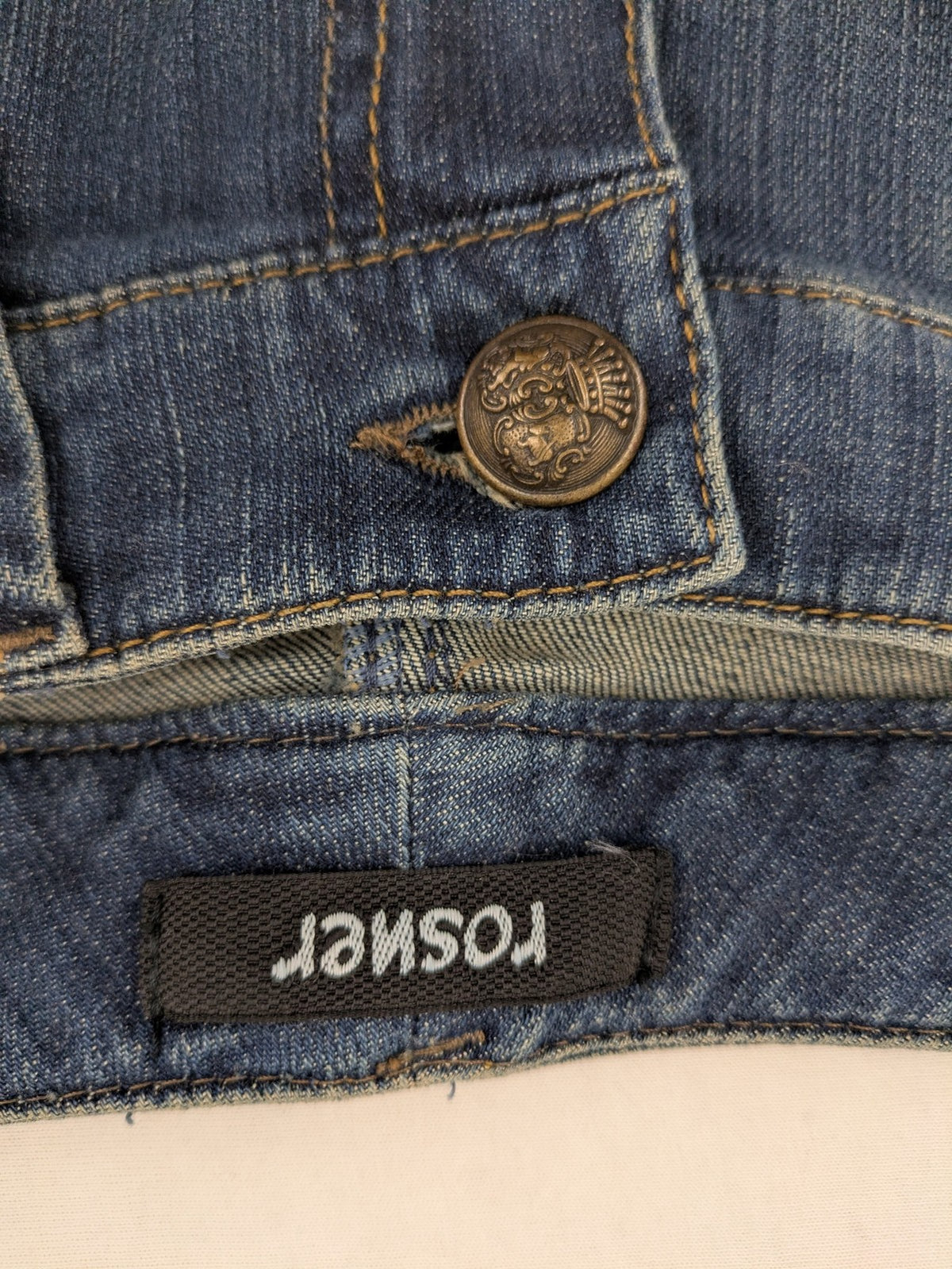 Rosner blue wide leg jeans with colorful embroidery on back pockets.