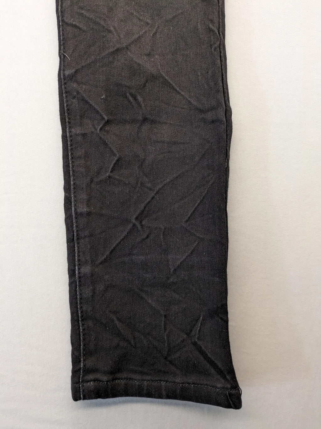 L & K Kaha black straight jeans with rhinestone logo patch and classic 5-pocket design.