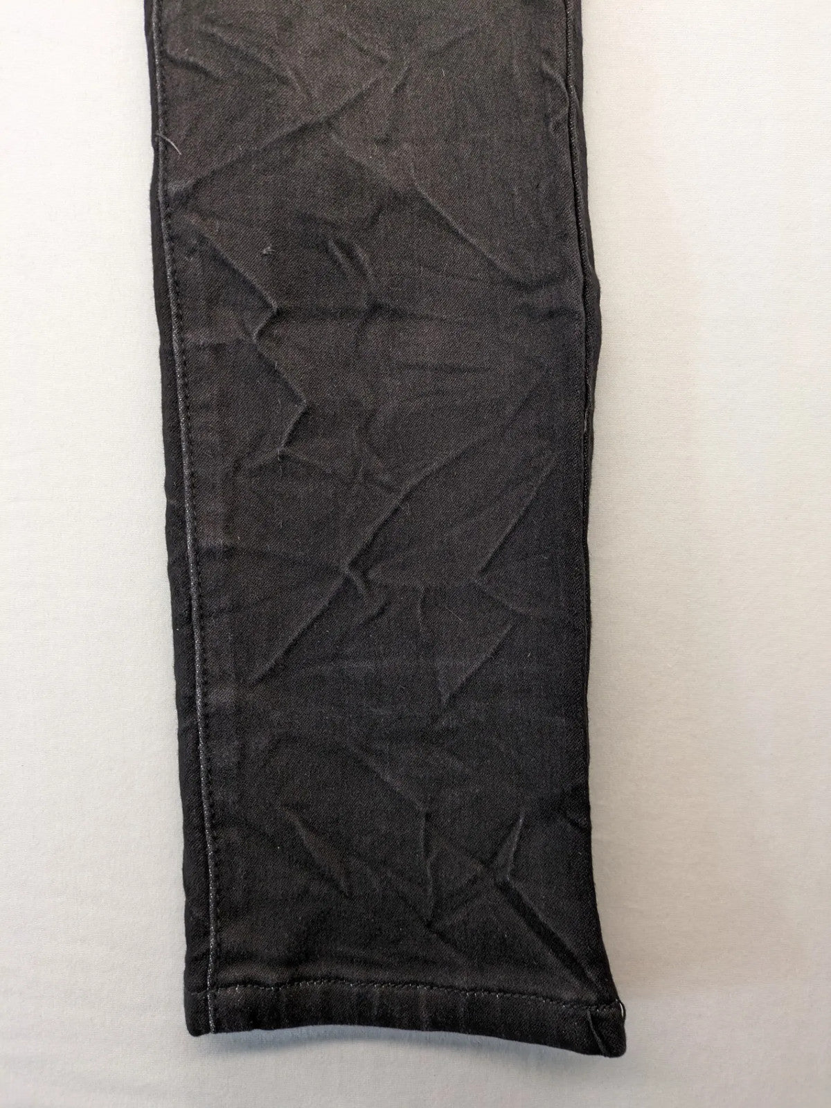 L & K Kaha black straight jeans with rhinestone logo patch and classic 5-pocket design.