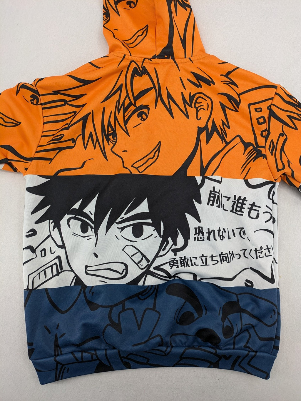 SHEIN orange zip-through hoodie with vibrant anime graphic print and colorblock design.