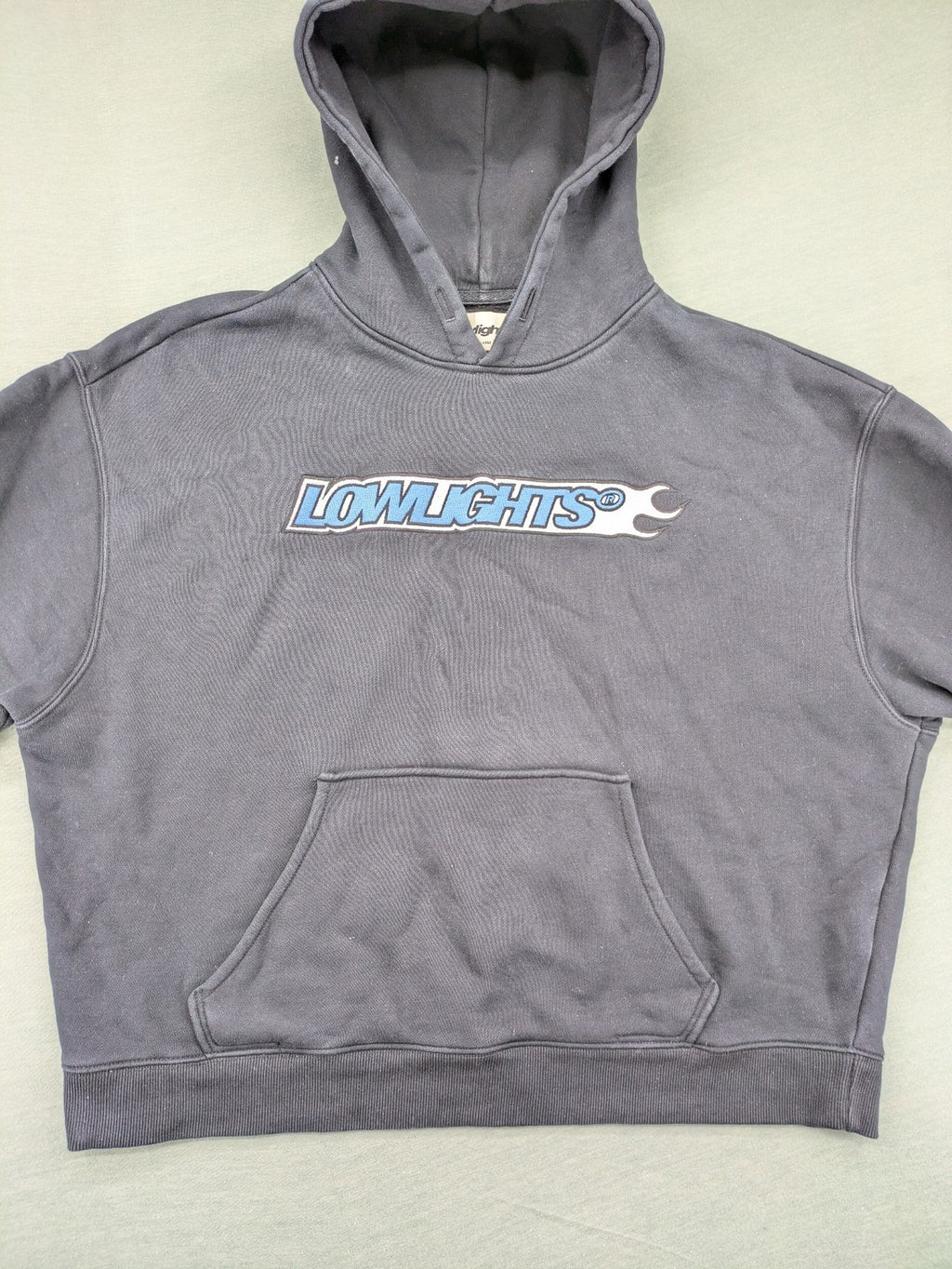Lowlights Studios grey hoodie with embroidered logo and kangaroo pocket, 100% cotton.