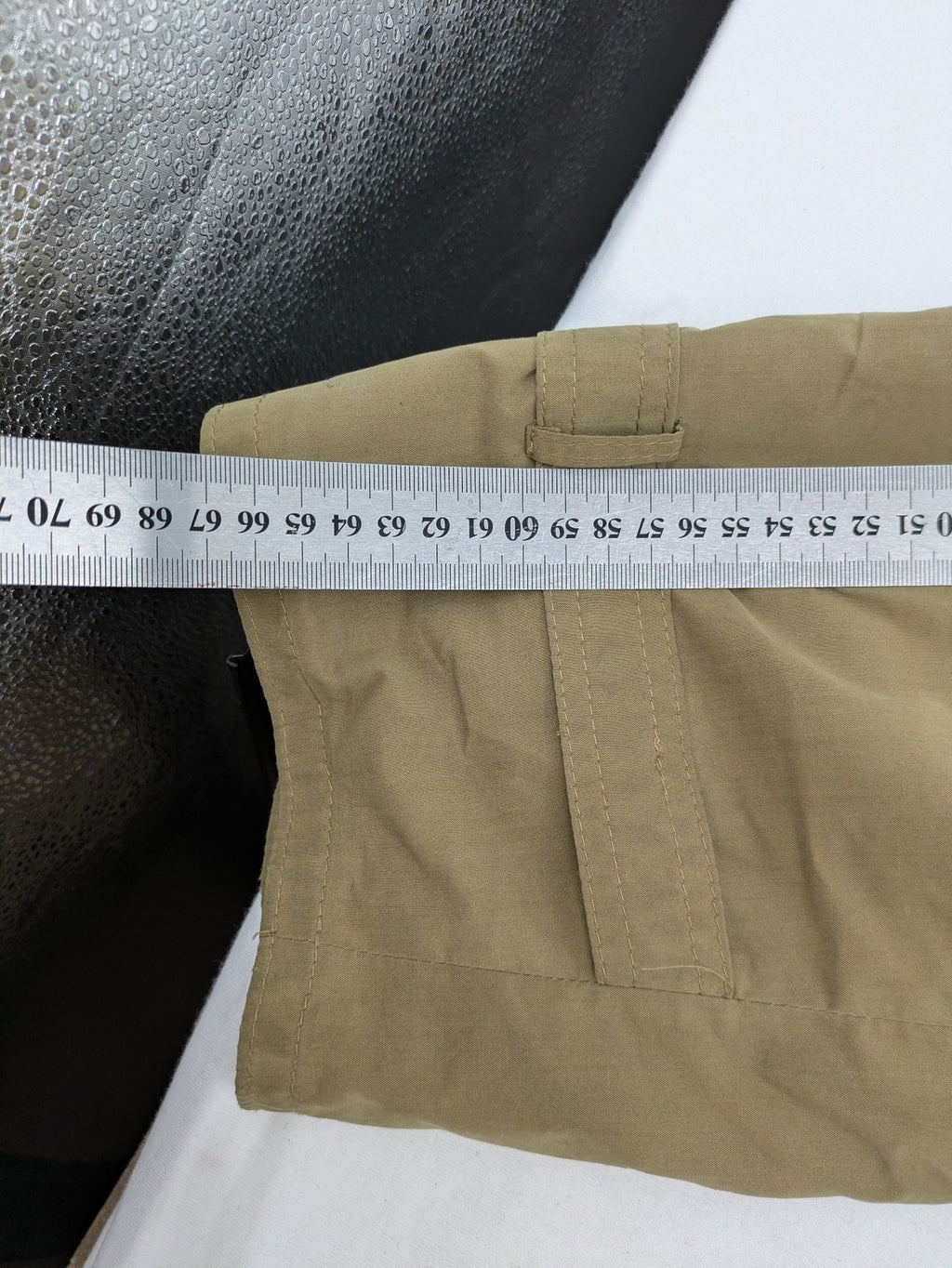 Studio Novum khaki trench coat double-breasted design with belt and wool lining.