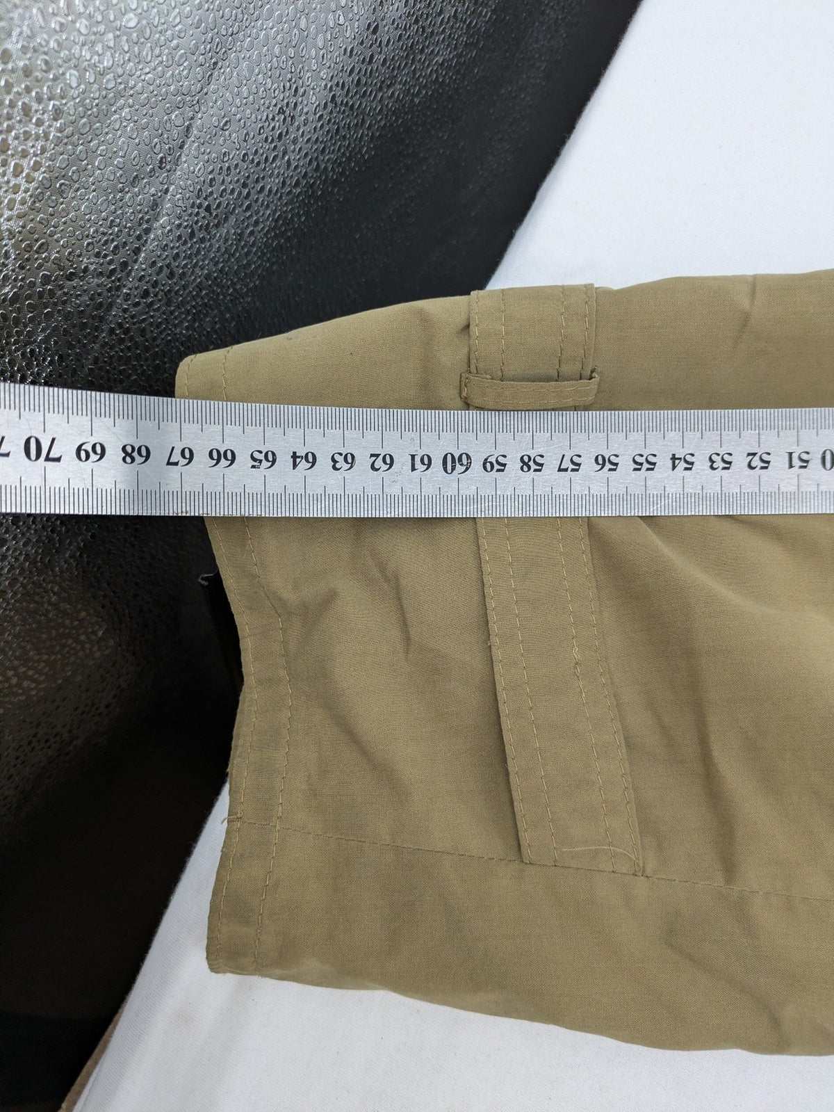 Studio Novum khaki trench coat double-breasted design with belt and wool lining.