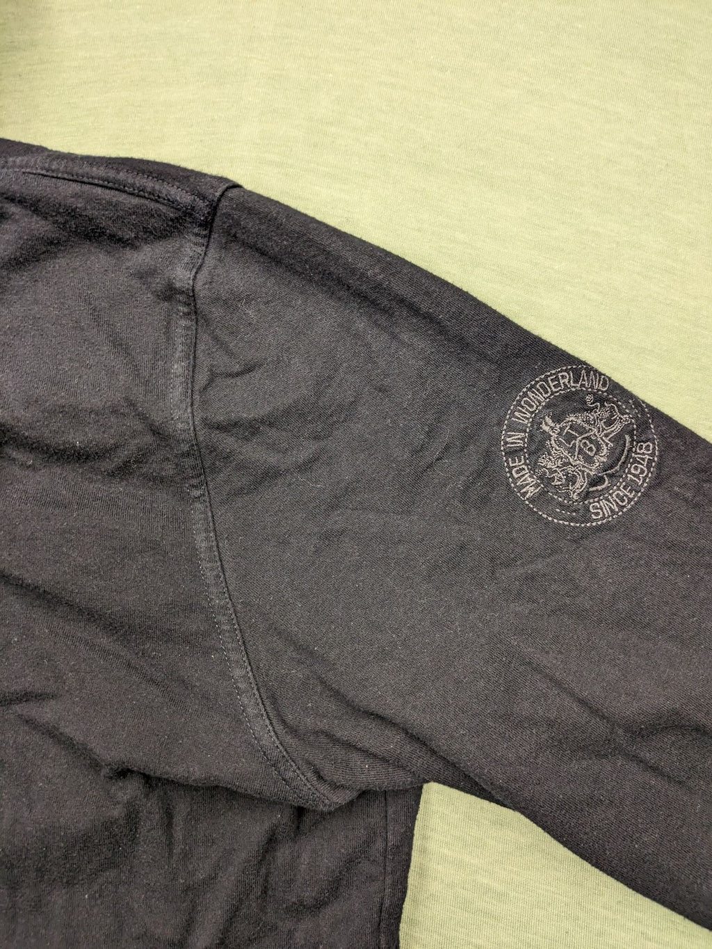 LTB black faded hoodie with adjustable drawstring and embroidered logo on sleeve.