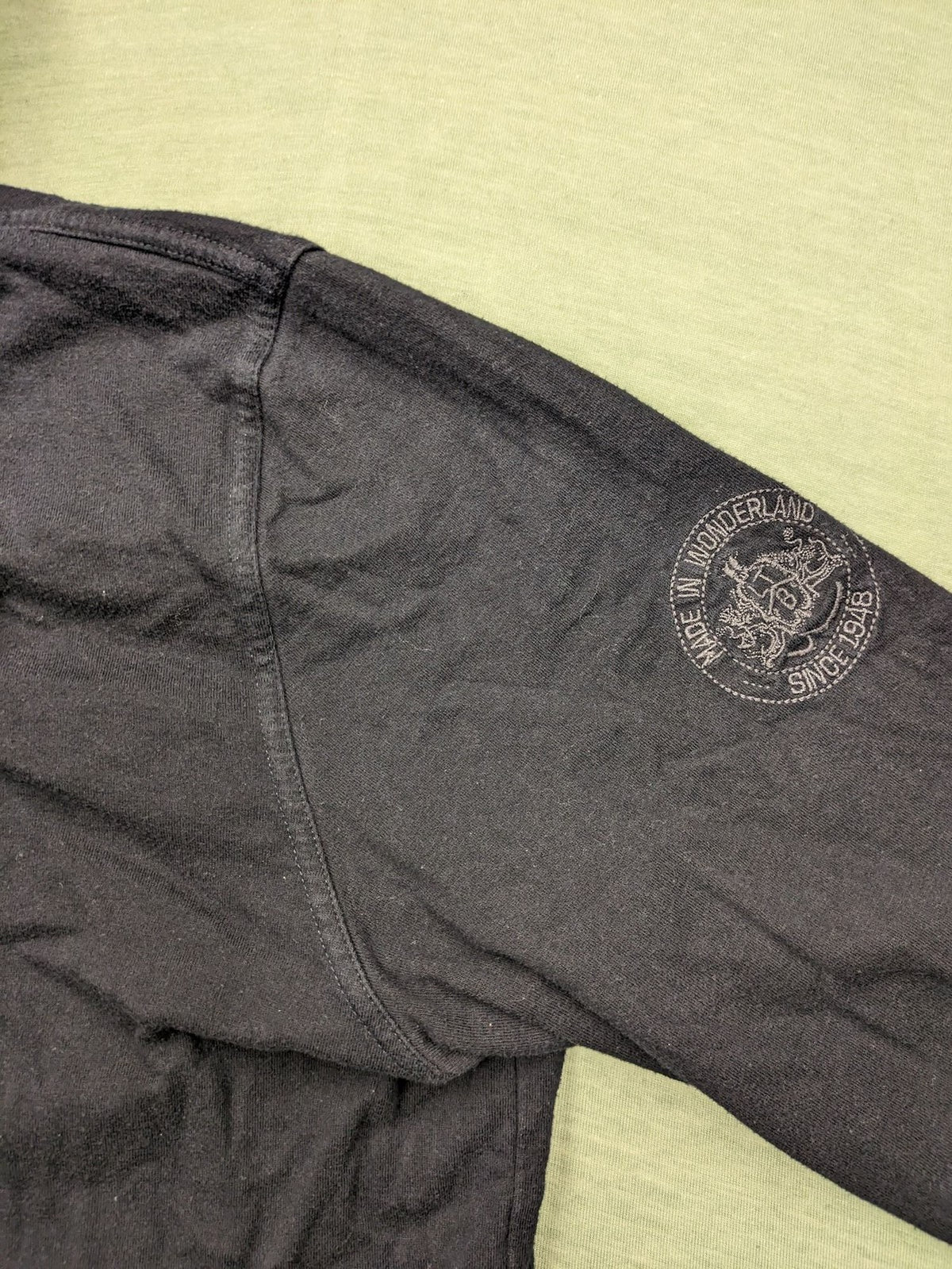 LTB black faded hoodie with adjustable drawstring and embroidered logo on sleeve.