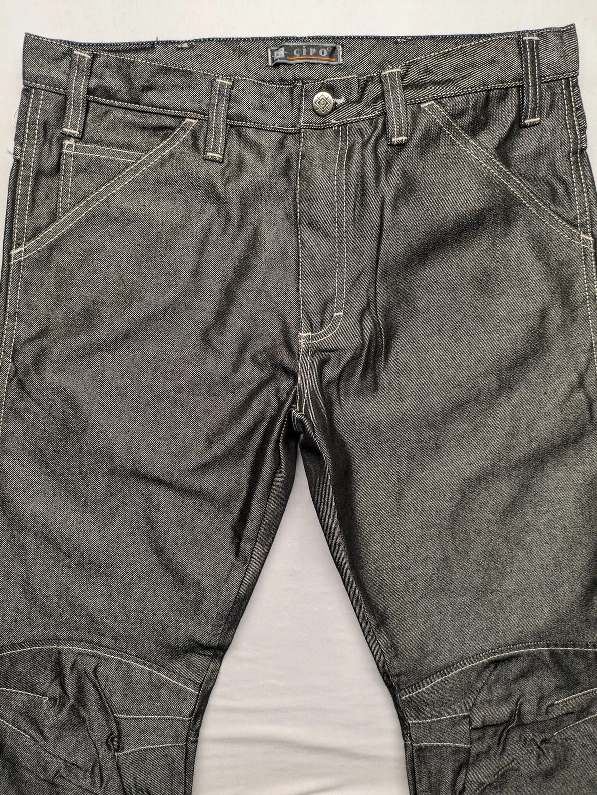 CIPO grey bootcut biker jeans with white contrast stitching and moto-inspired knee pleats.