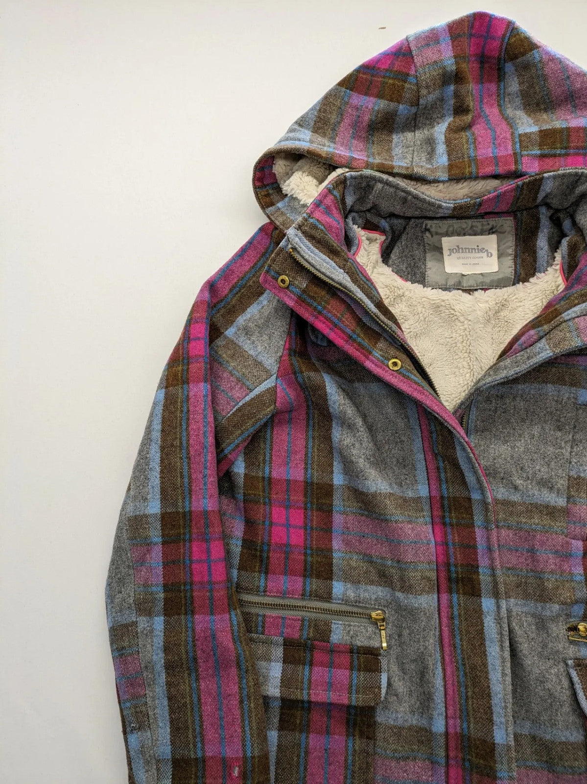 Johnnie B pink coat with gray check pattern, Sherpa lining, and zip closure.