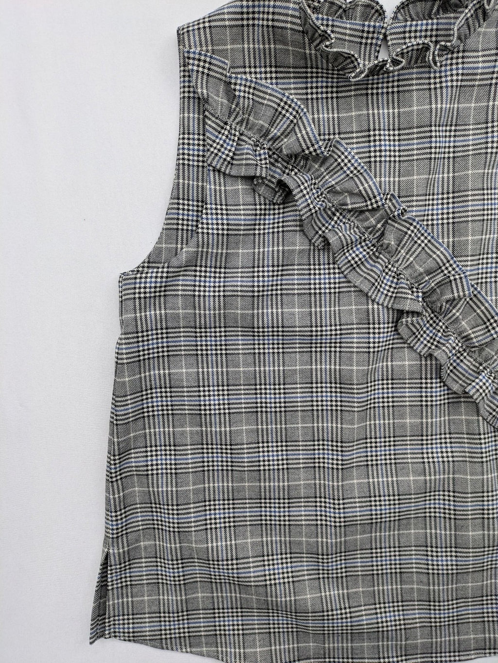 Zara ruffled sleeveless blouse grey check pattern high ruffle collar with blue, black, white accents