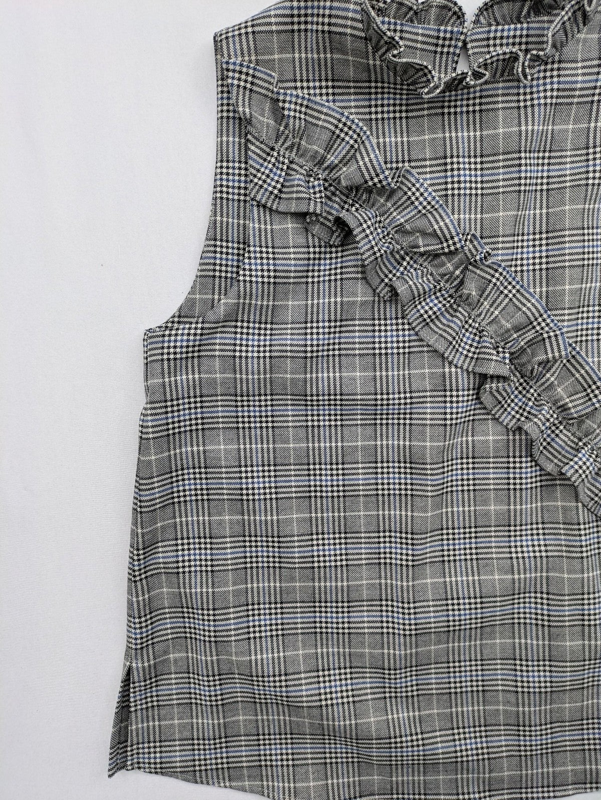 Zara ruffled sleeveless blouse grey check pattern high ruffle collar with blue, black, white accents