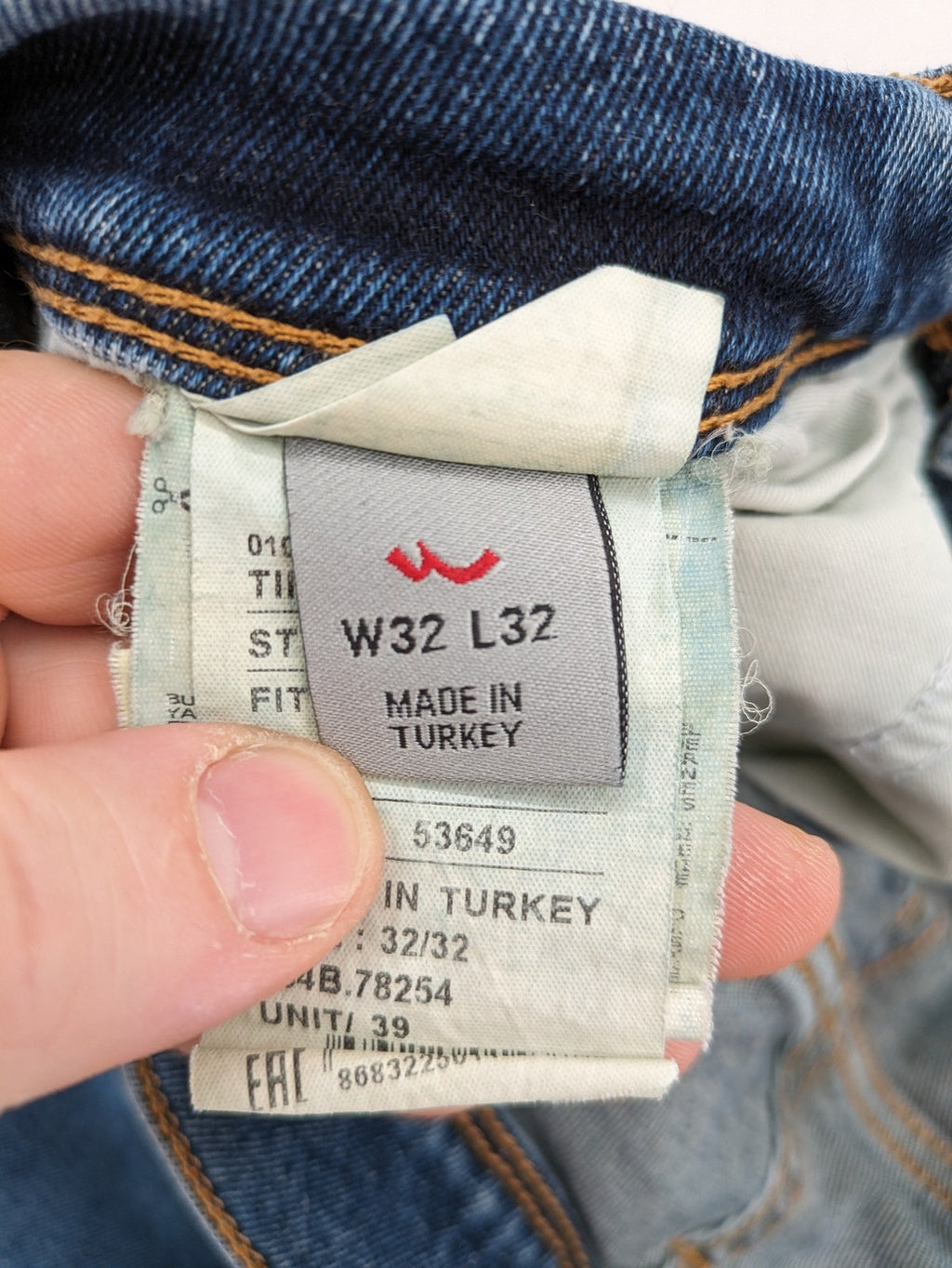 LTB blue straight jeans with low rise, button fly, and classic denim wash.