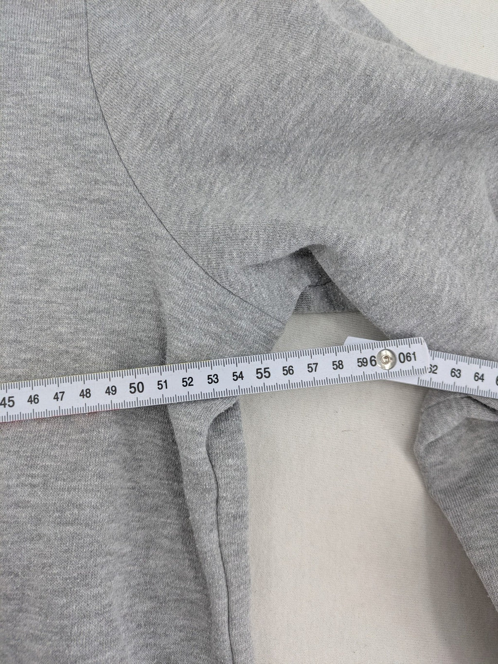 Primark grey zip-through hoodie featuring yellow Smiley logo and Nevermind graphic.